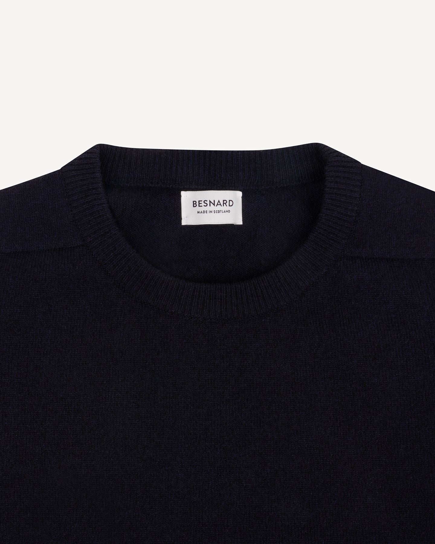 A navy sweater with crew neck