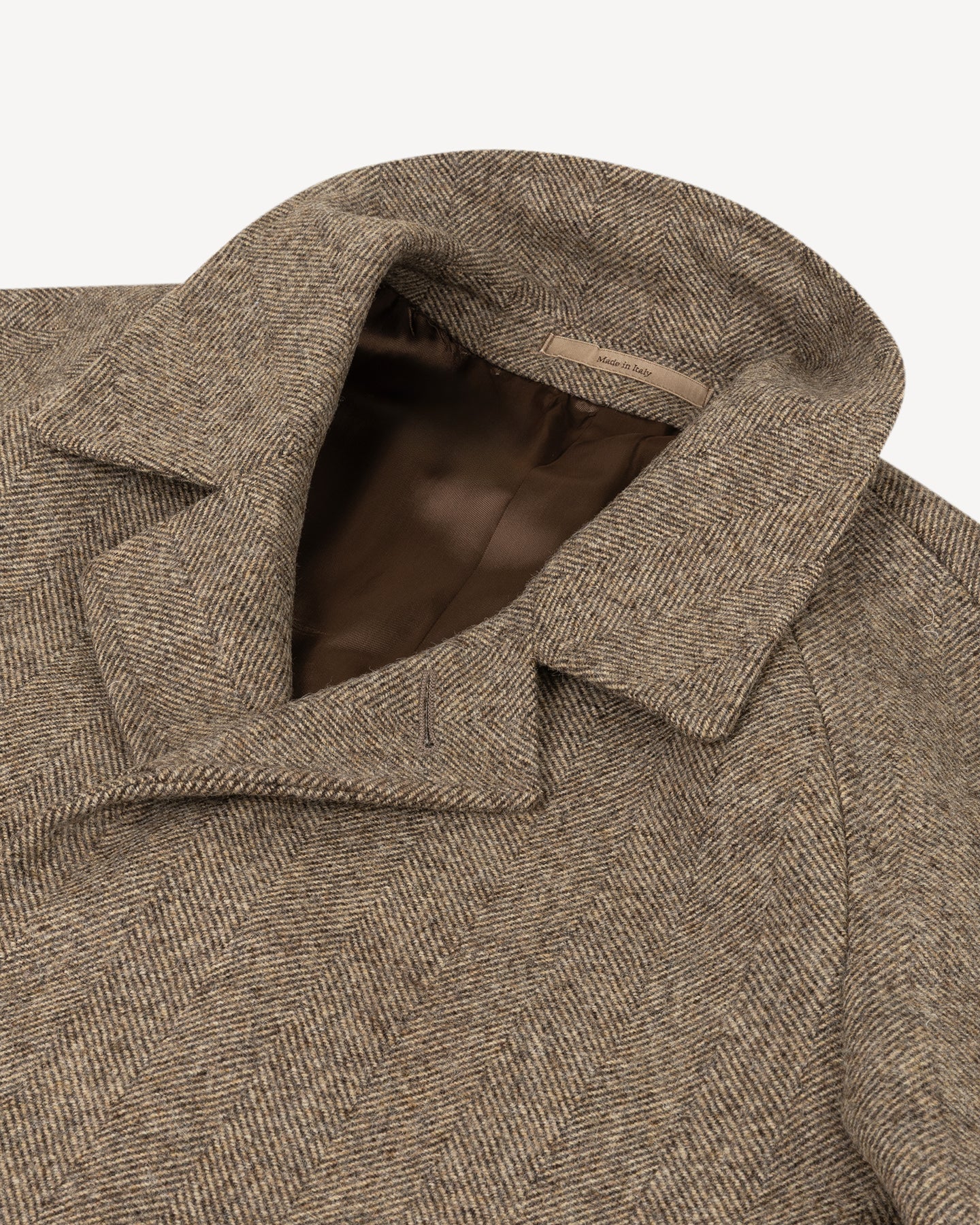 Light brown herringbone coat with generous collar