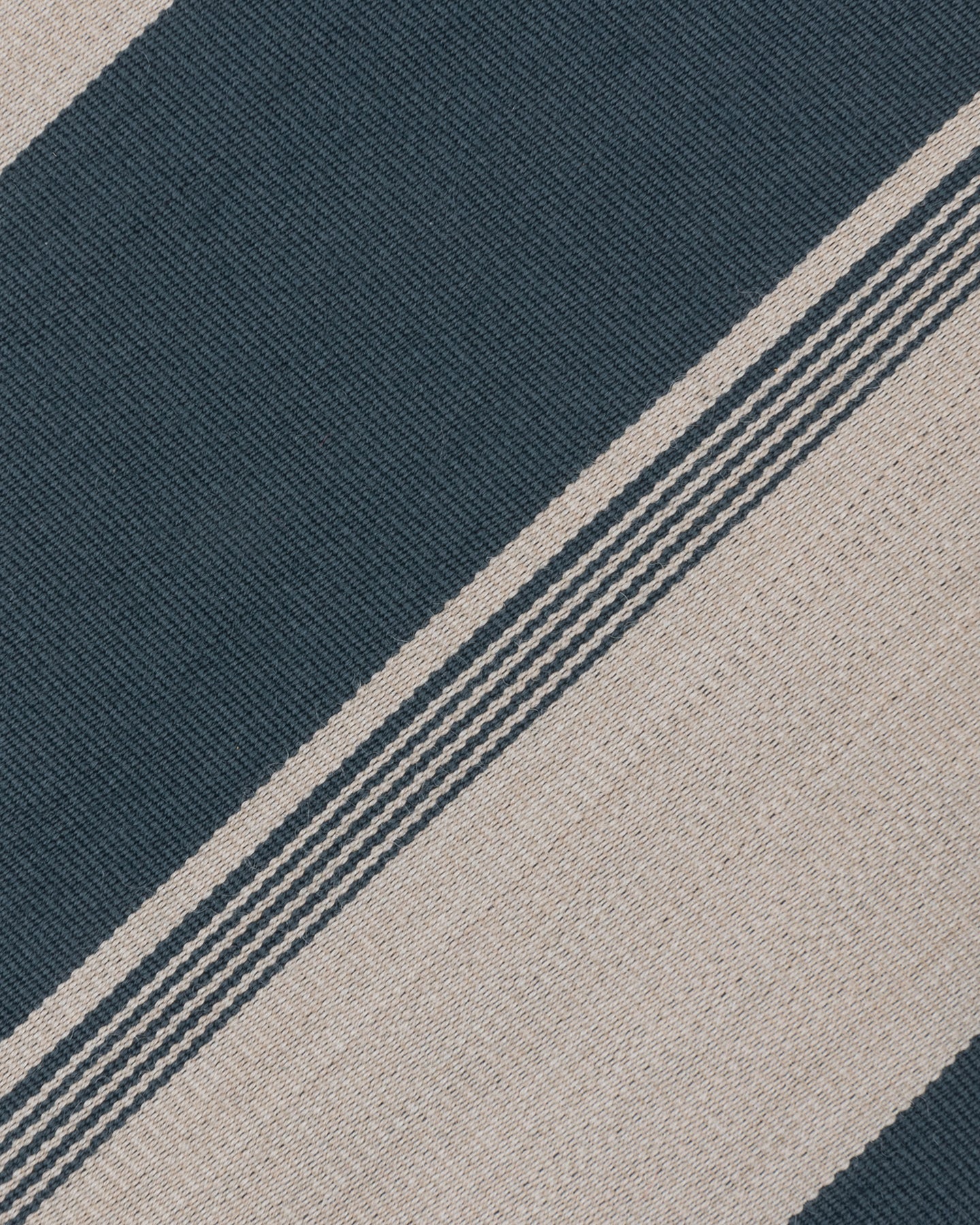 Zoom of petrol and beige stripe wool cotton fabric