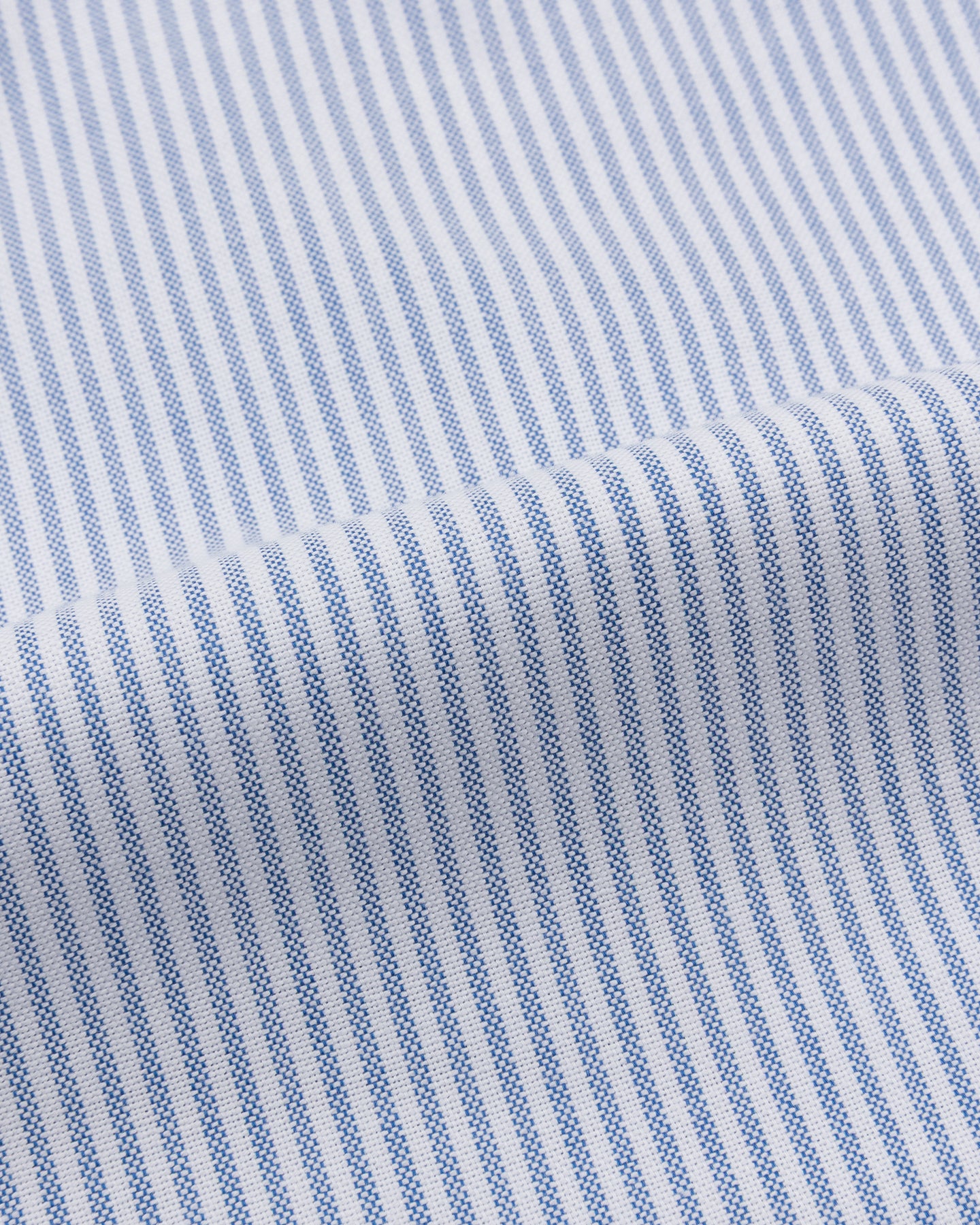 A close up of  a blue University stripe Oxford cloth