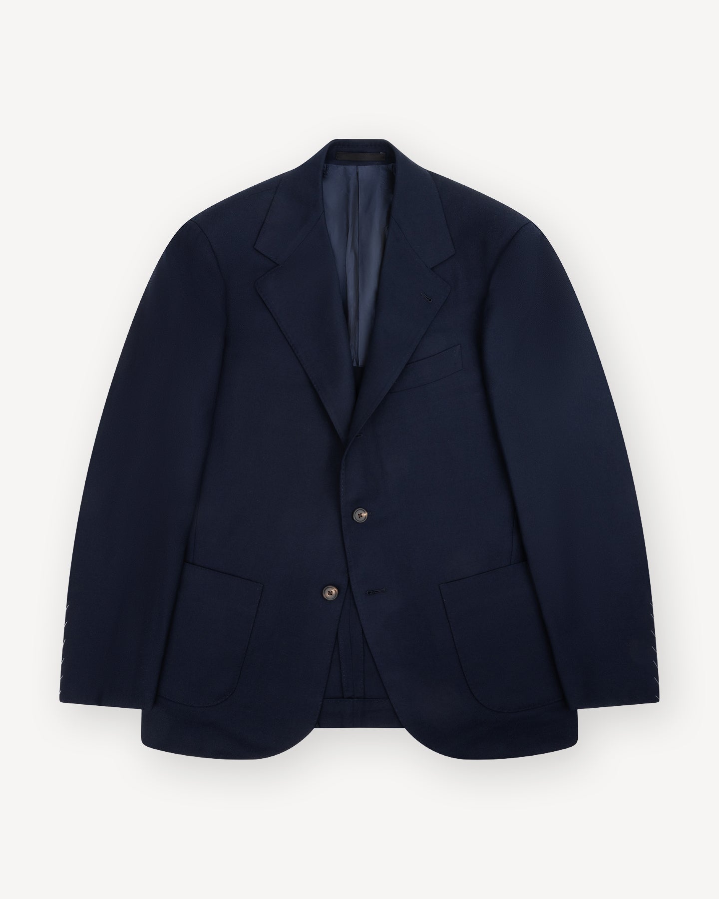 A navy hopsack sport coat with notch lapels and patch pockets