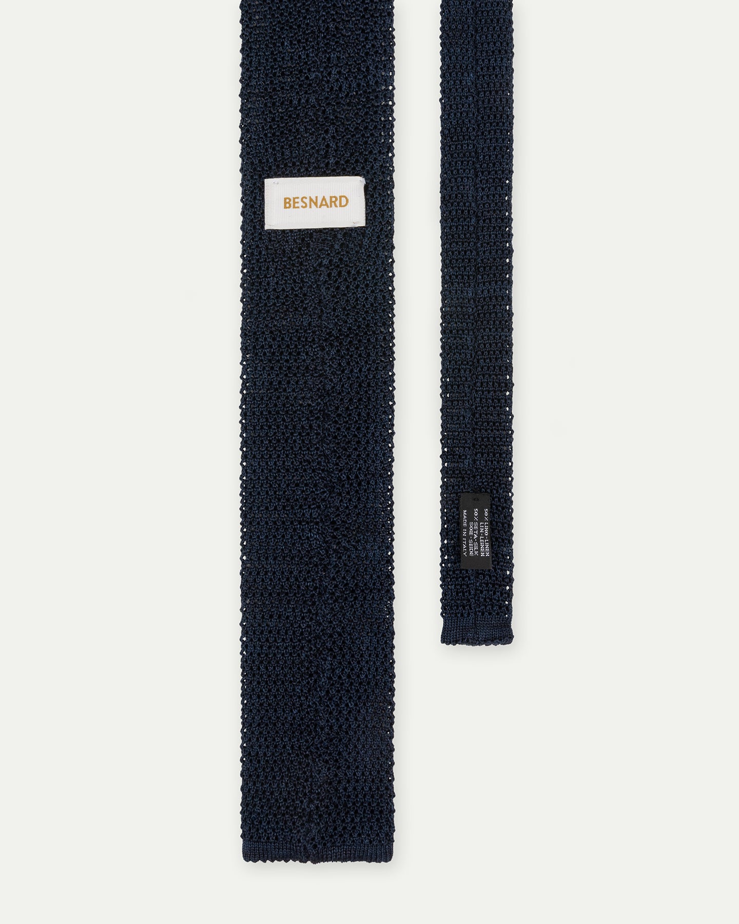 The back of a Navy Melange Knitted Silk Linen Tie