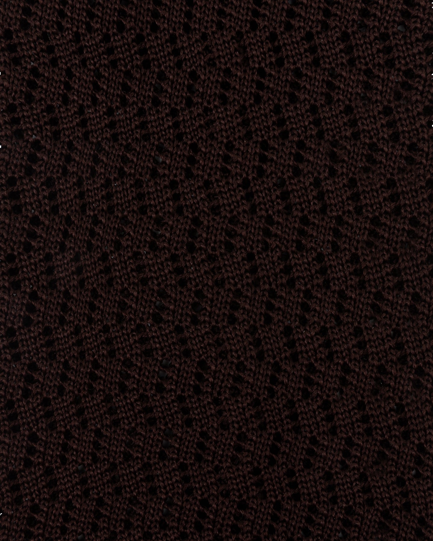 A close up of brown knitted silk with zigzag pattern