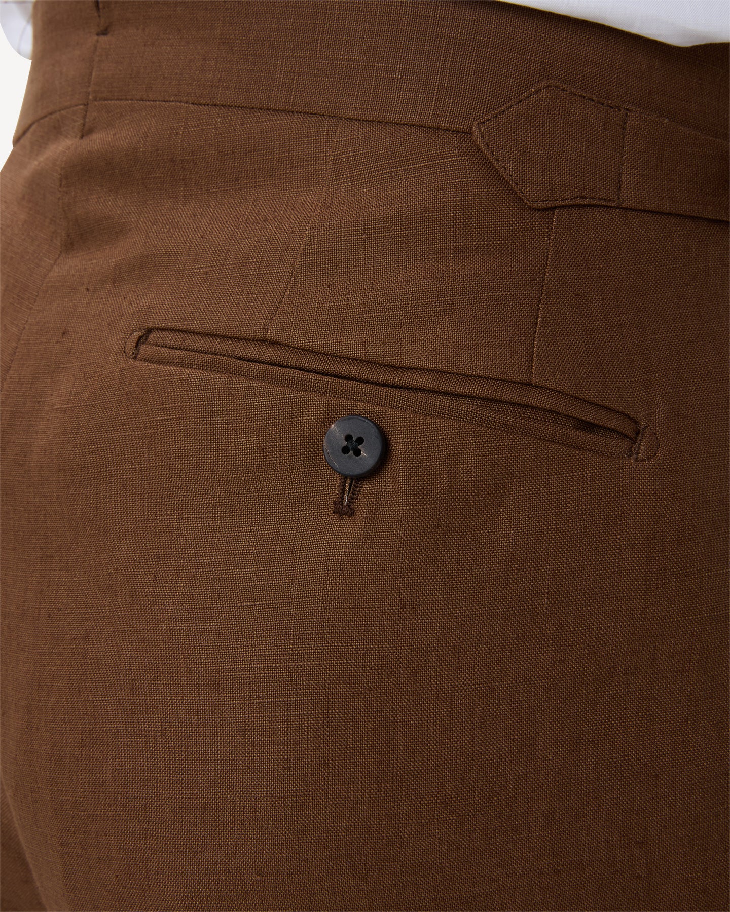 Dark tan linen trousers with horn buttons