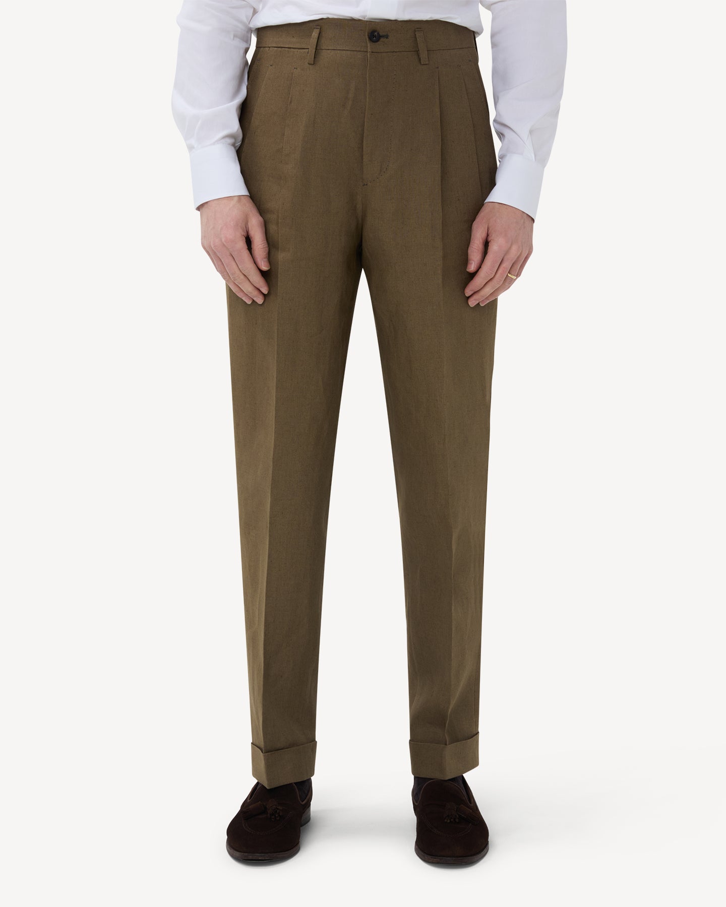 The front of olive brown linen trousers with double pleats and belt loops