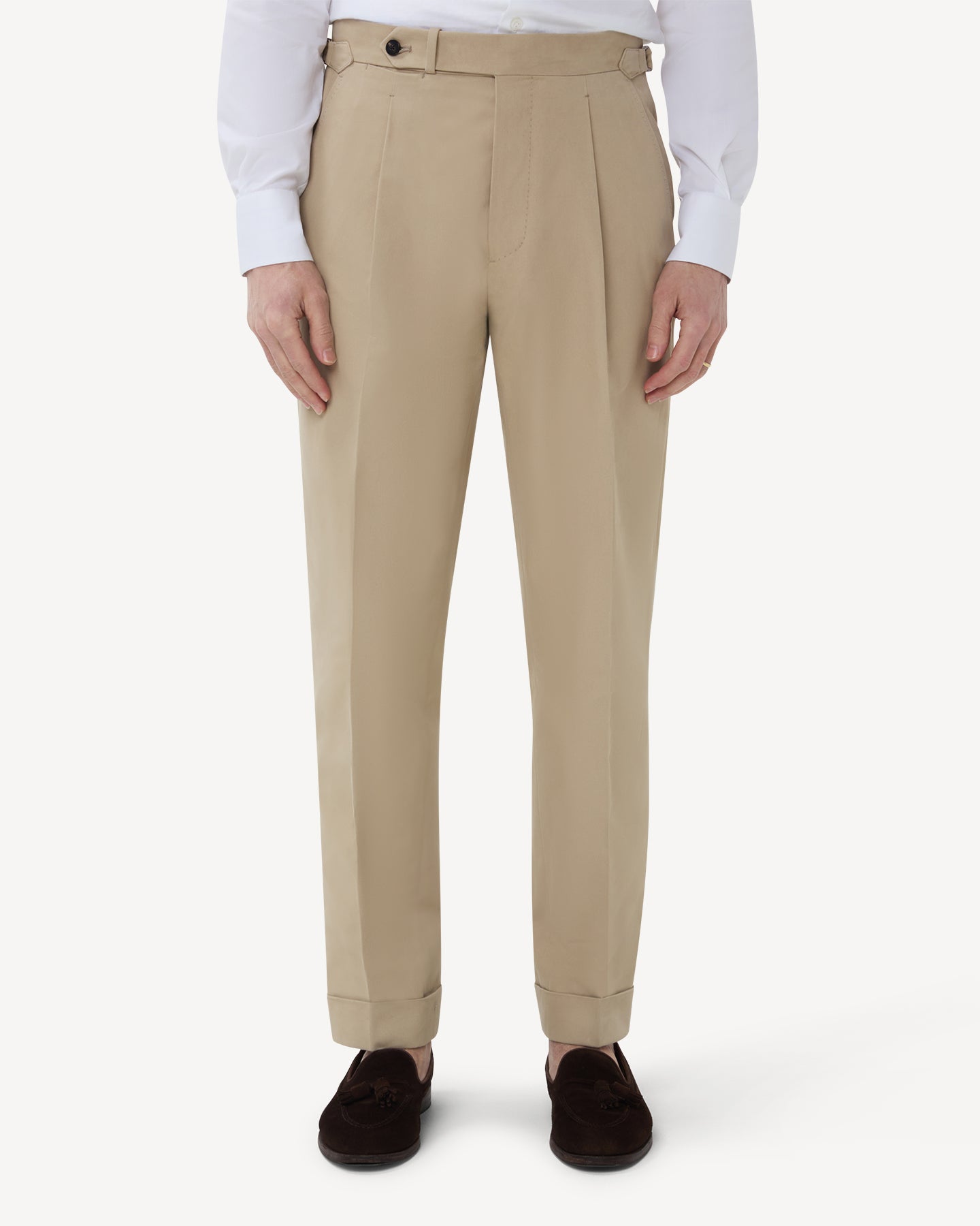 The front of stone cotton trousers with single pleats and side adjusters