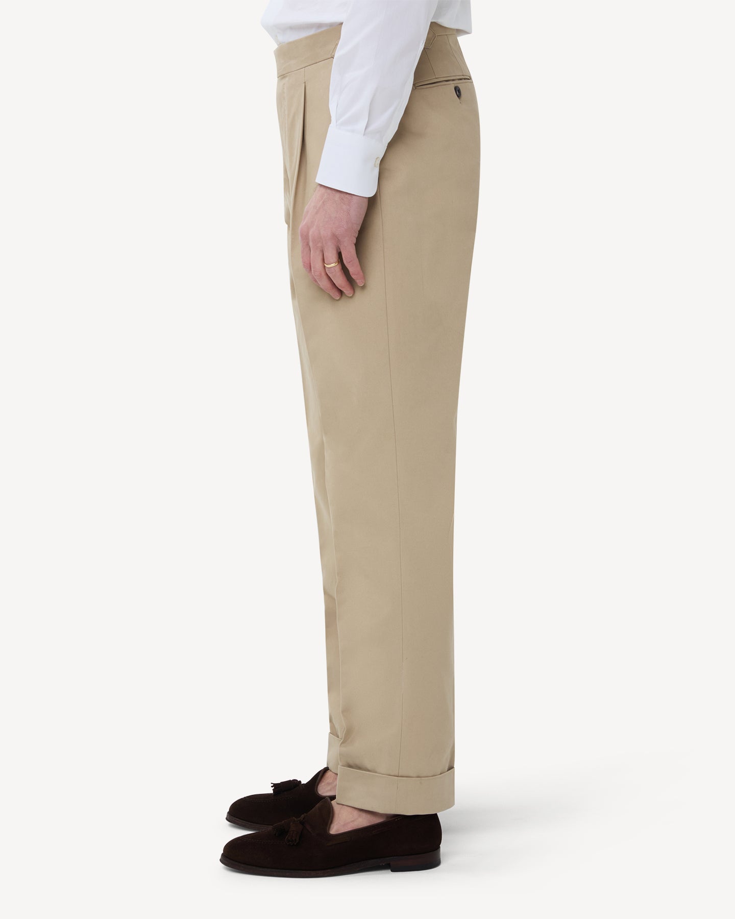 The side of stone cotton trousers with single pleats and side adjusters
