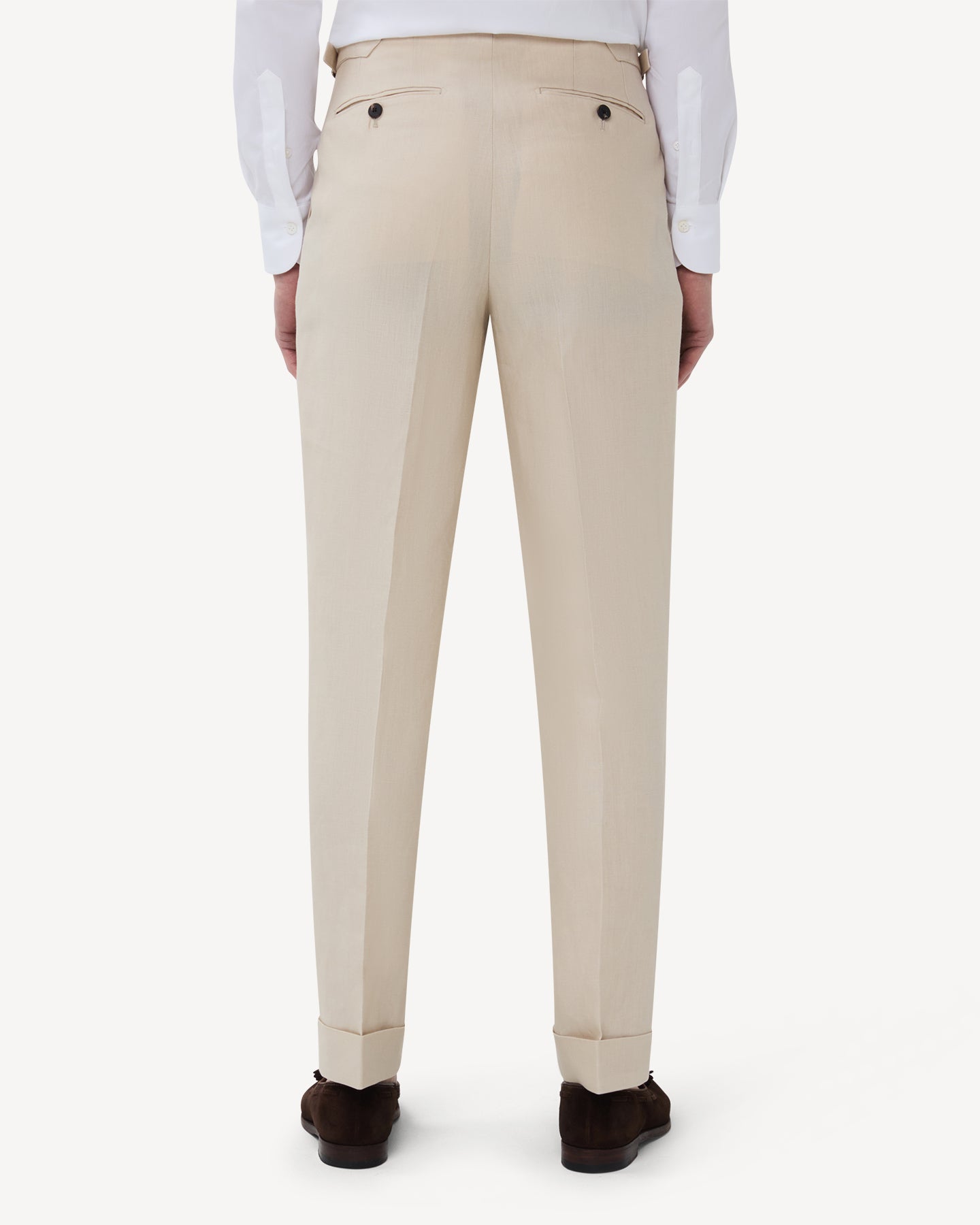 The back of stone linen trousers with single pleats and side adjusters