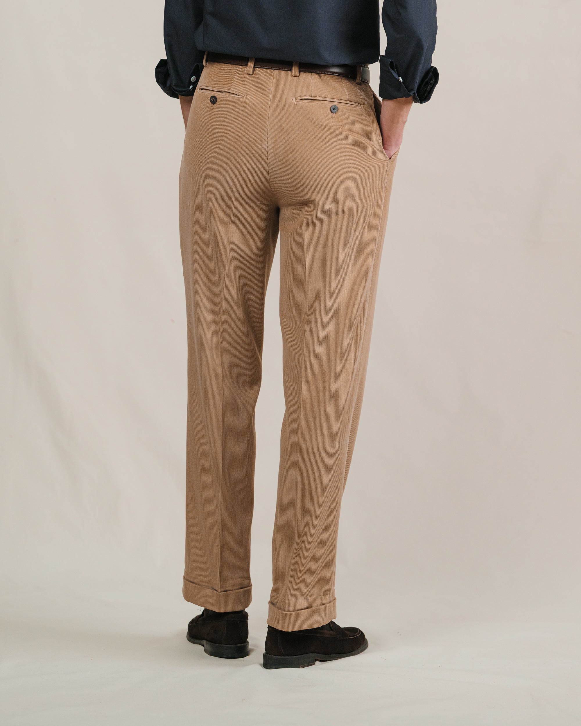 Person wearing brown corduroy trousers