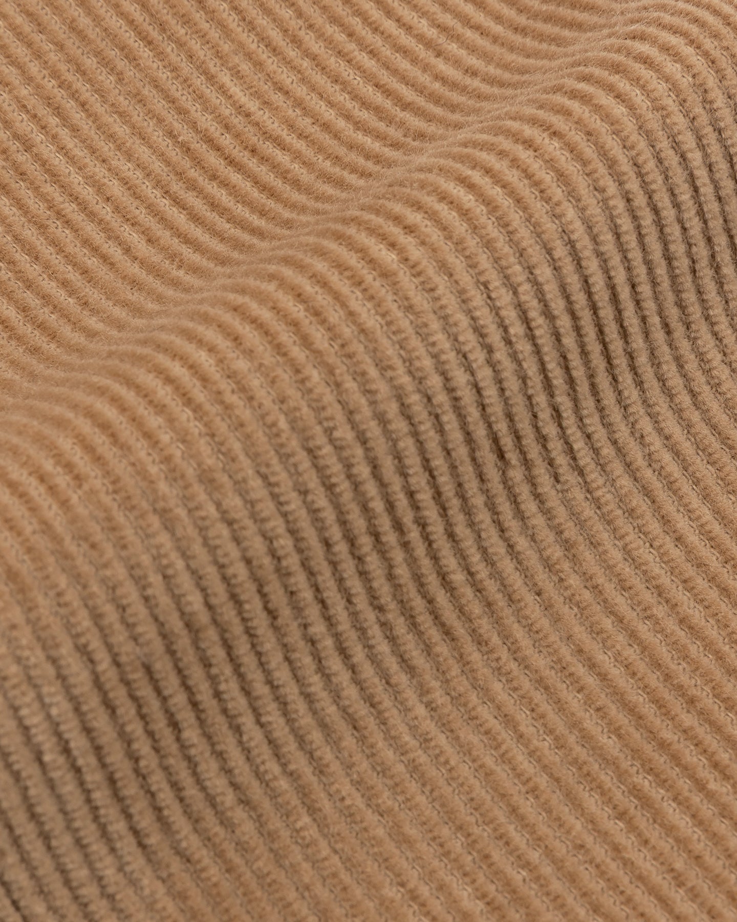 A close up of camel corduroy fabric