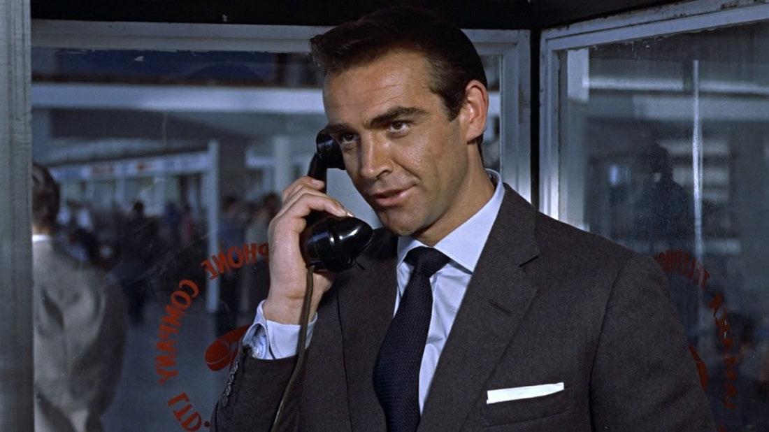 Sean Connery wears a navy Garza Grossa Grenadine tie as James Bond in Dr No