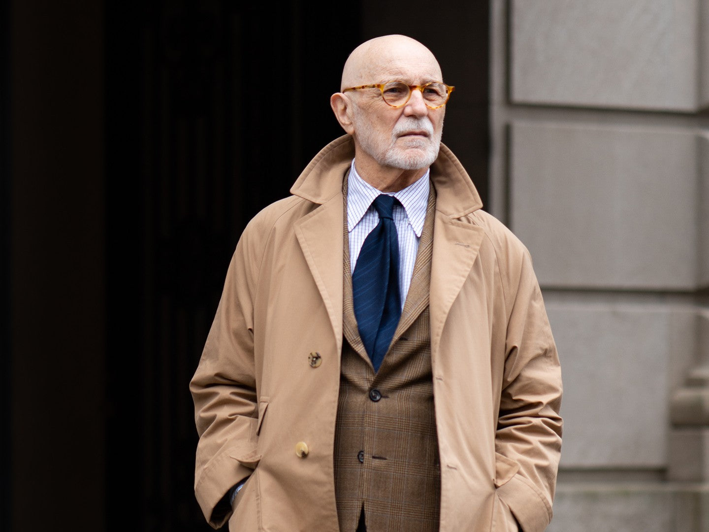 G. Bruce Boyer wearing a check sport coat, raglan raincoat, point collar shirt and tie