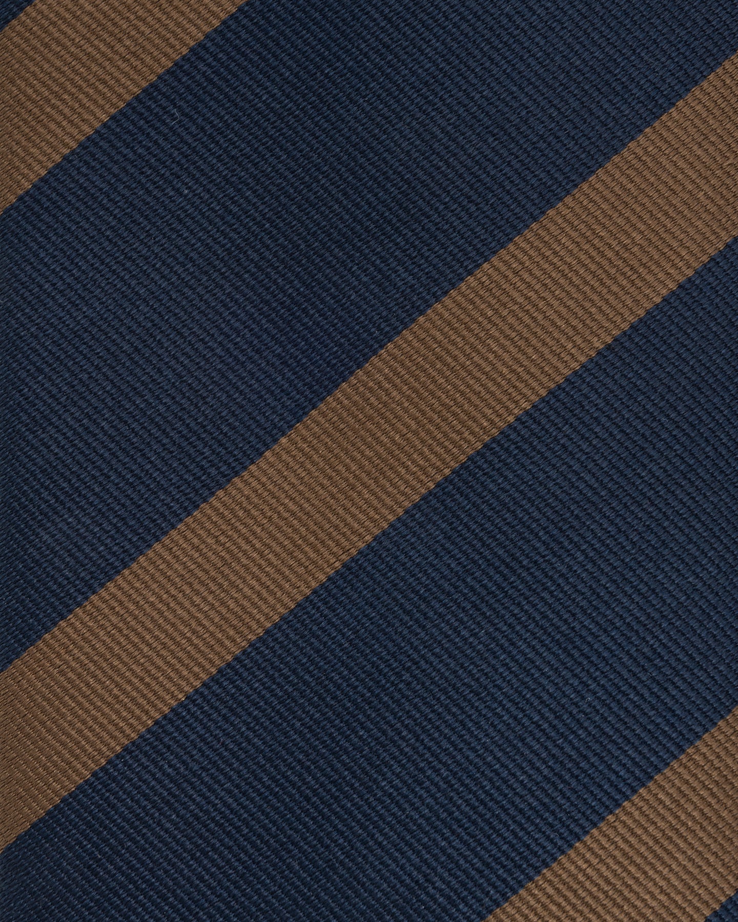 Close-up of dark navy and tobacco repp weave