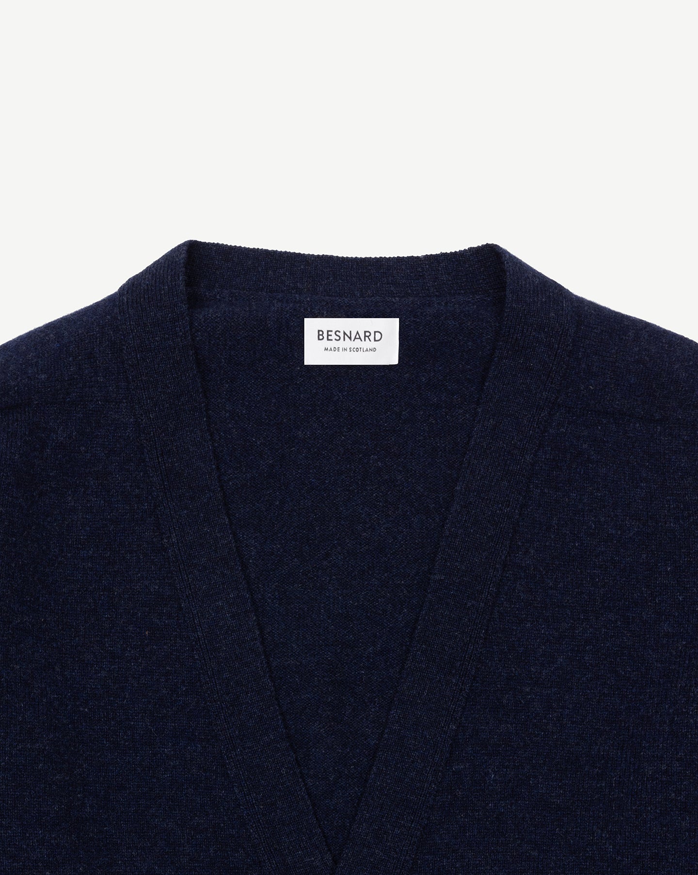 A dark blue lambswool cardigan