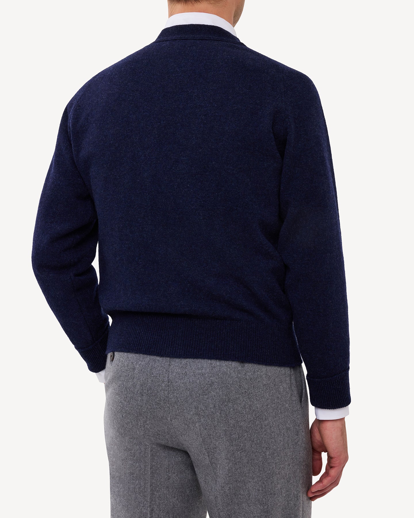 Man wearing a dark blue lambswool cardigan