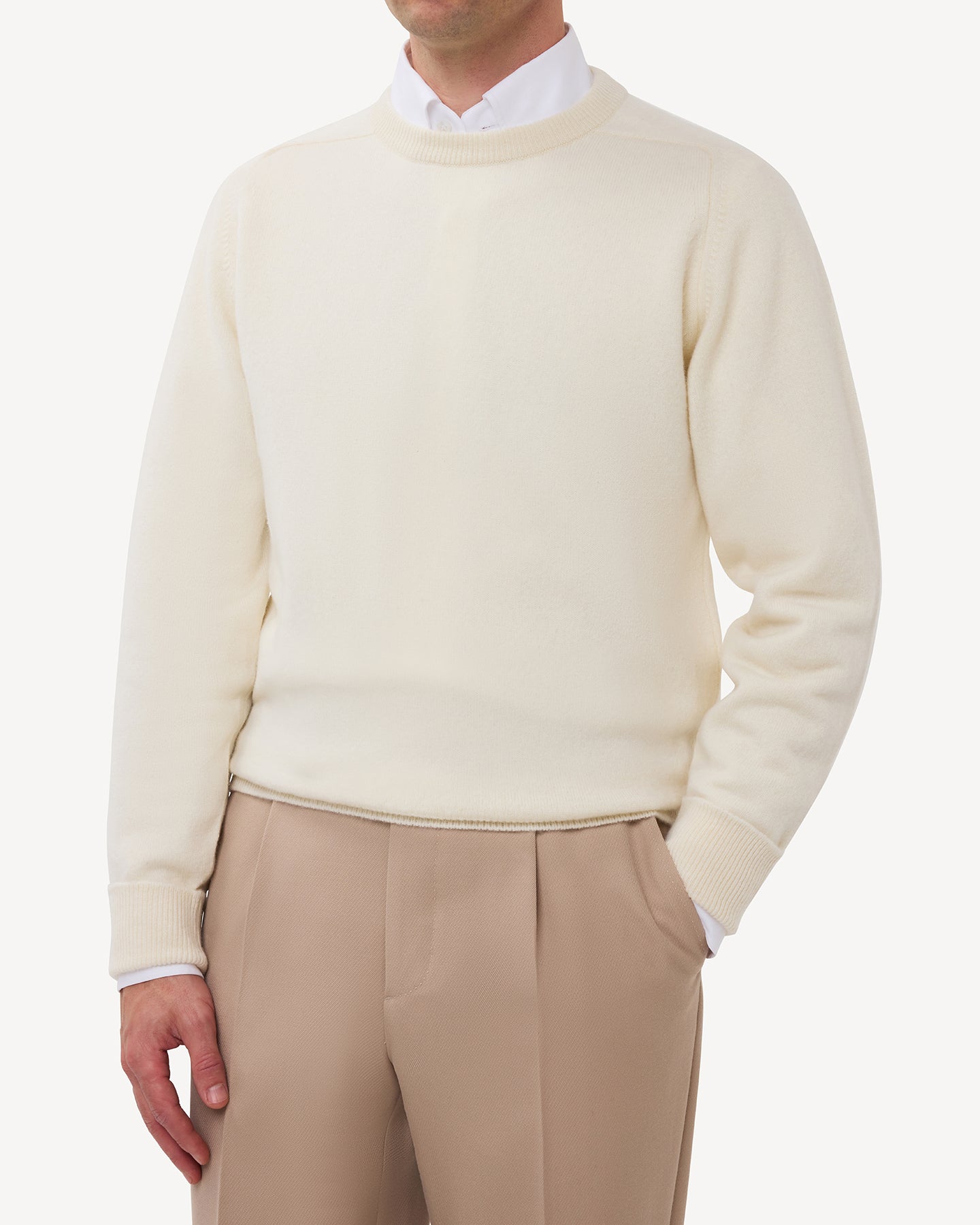 Man wearing an ecru lambswool crew neck sweater