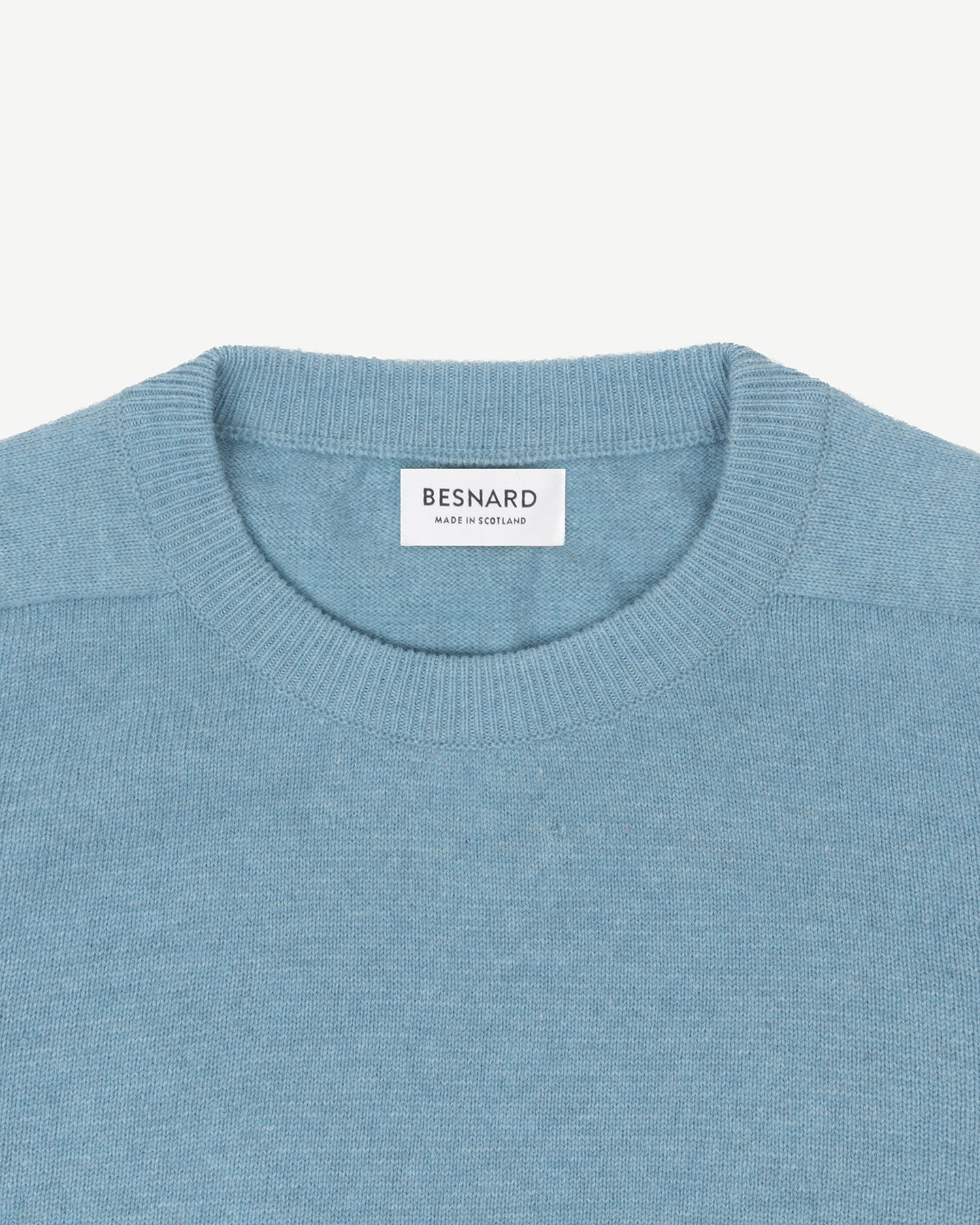 A light blue lambswool crew neck sweater