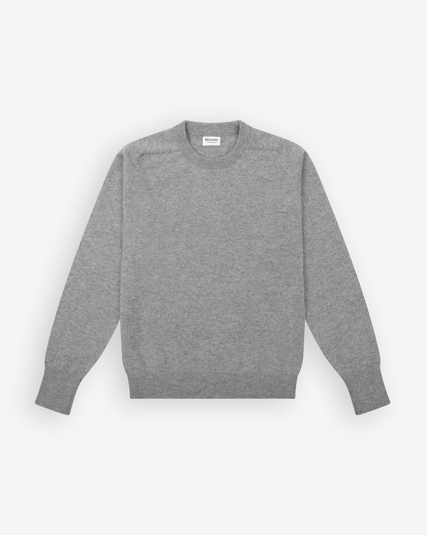 A light grey lambswool crew neck sweater