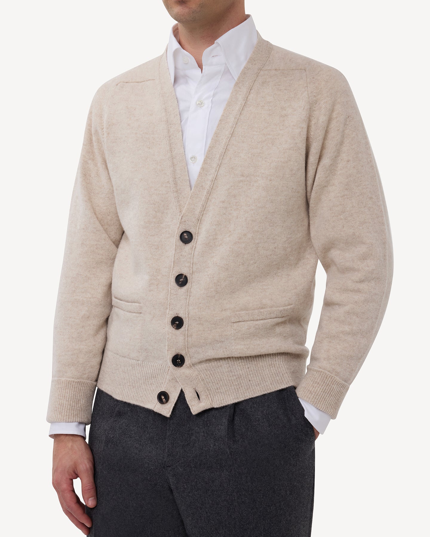 Man wearing an oatmeal lambswool cardigan