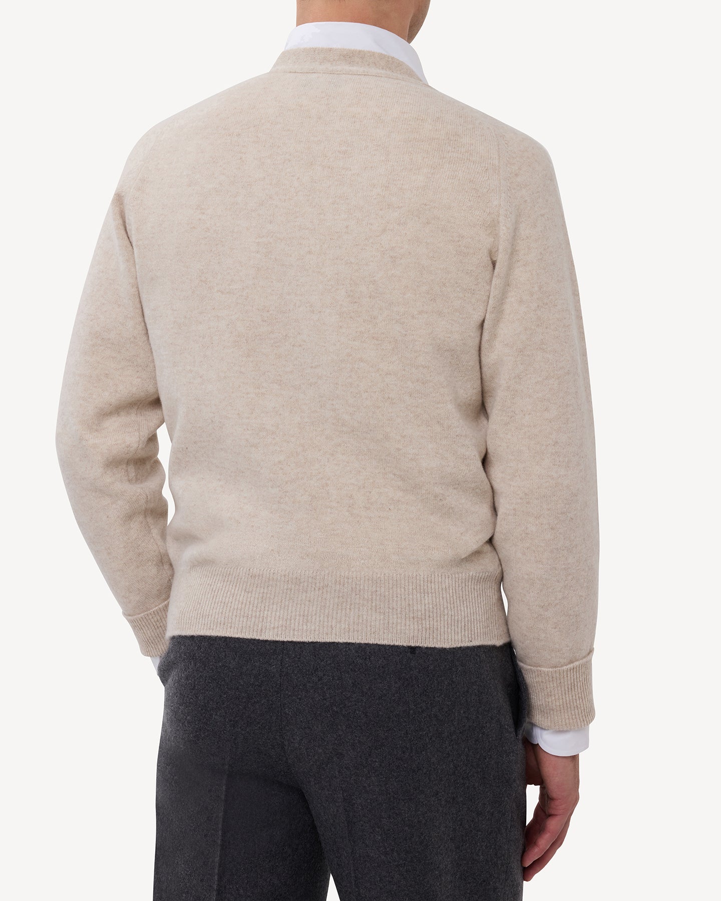 Man wearing an oatmeal lambswool cardigan