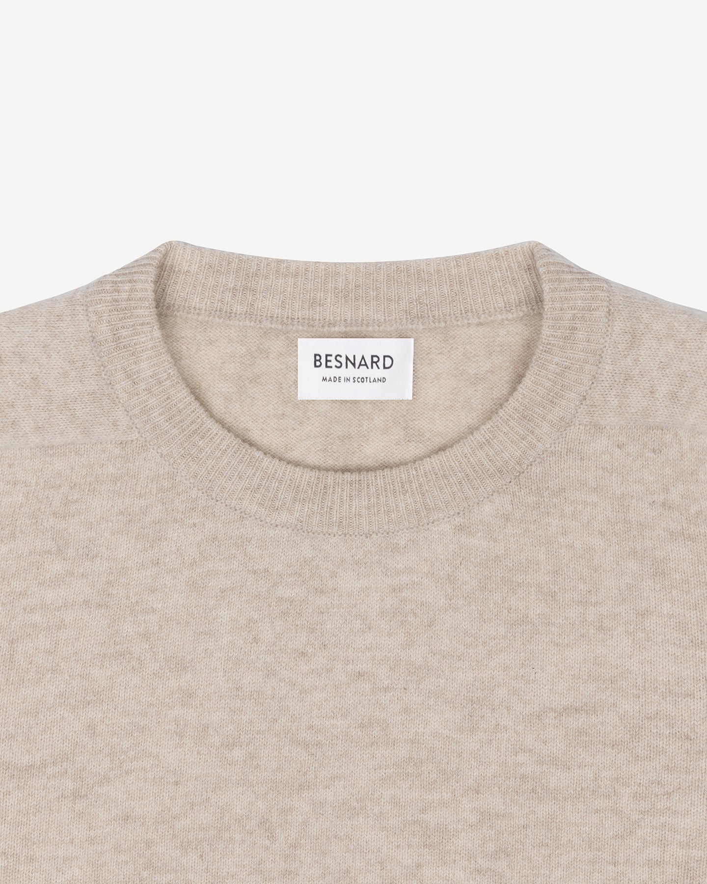 An oatmeal lambswool crew neck sweater