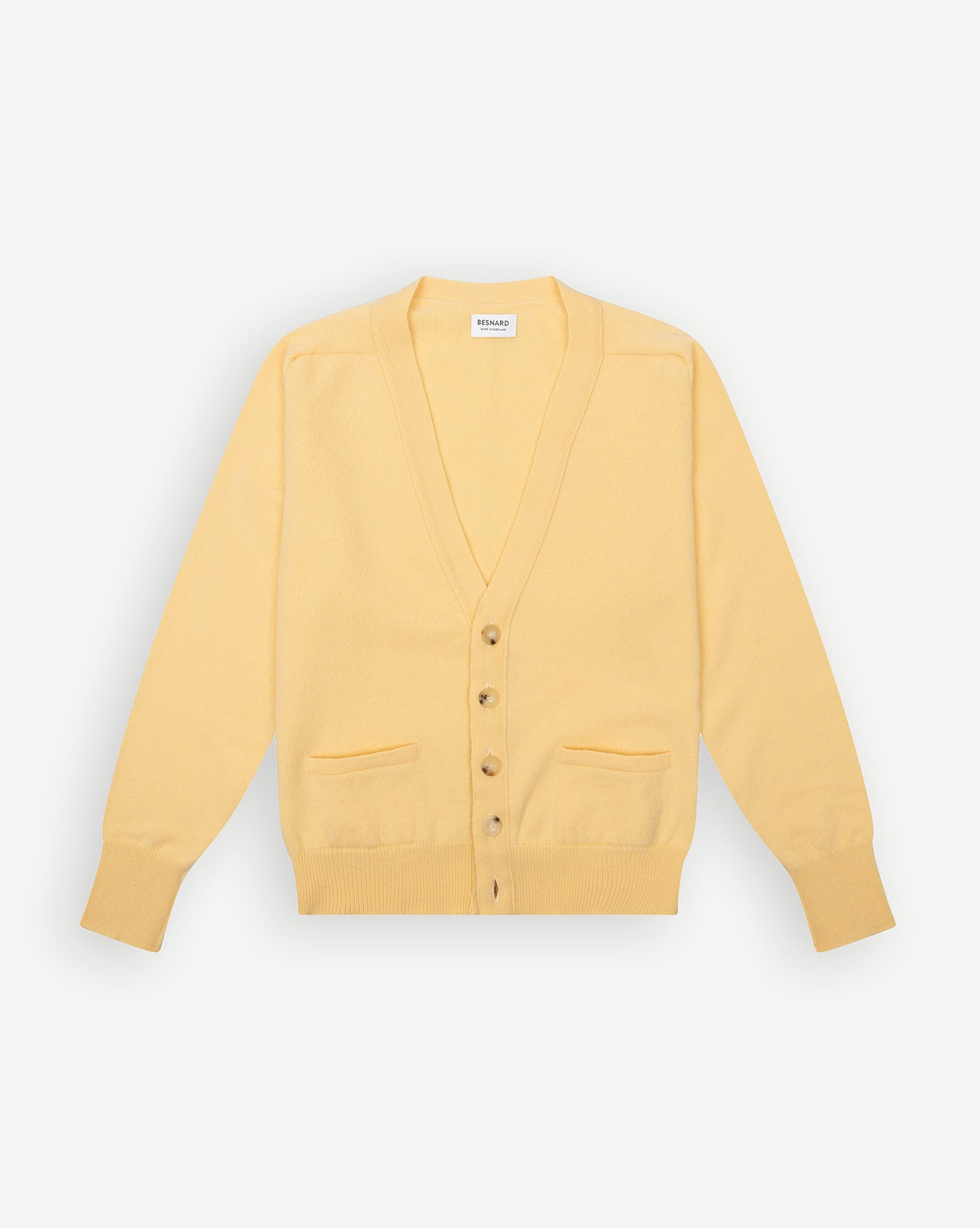 Yellow cardigan with horn buttons