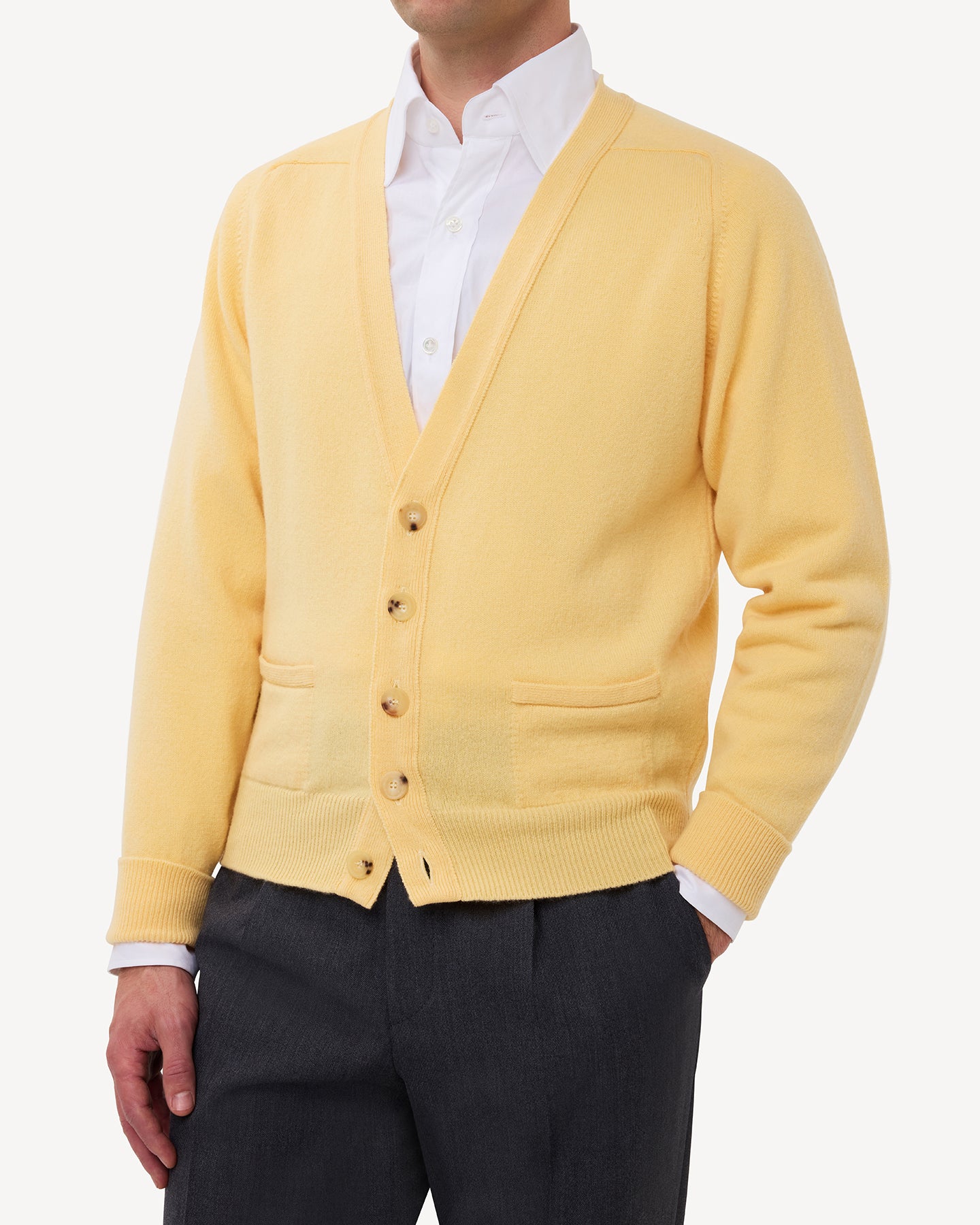 Man wearing a yellow lambswool cardigan