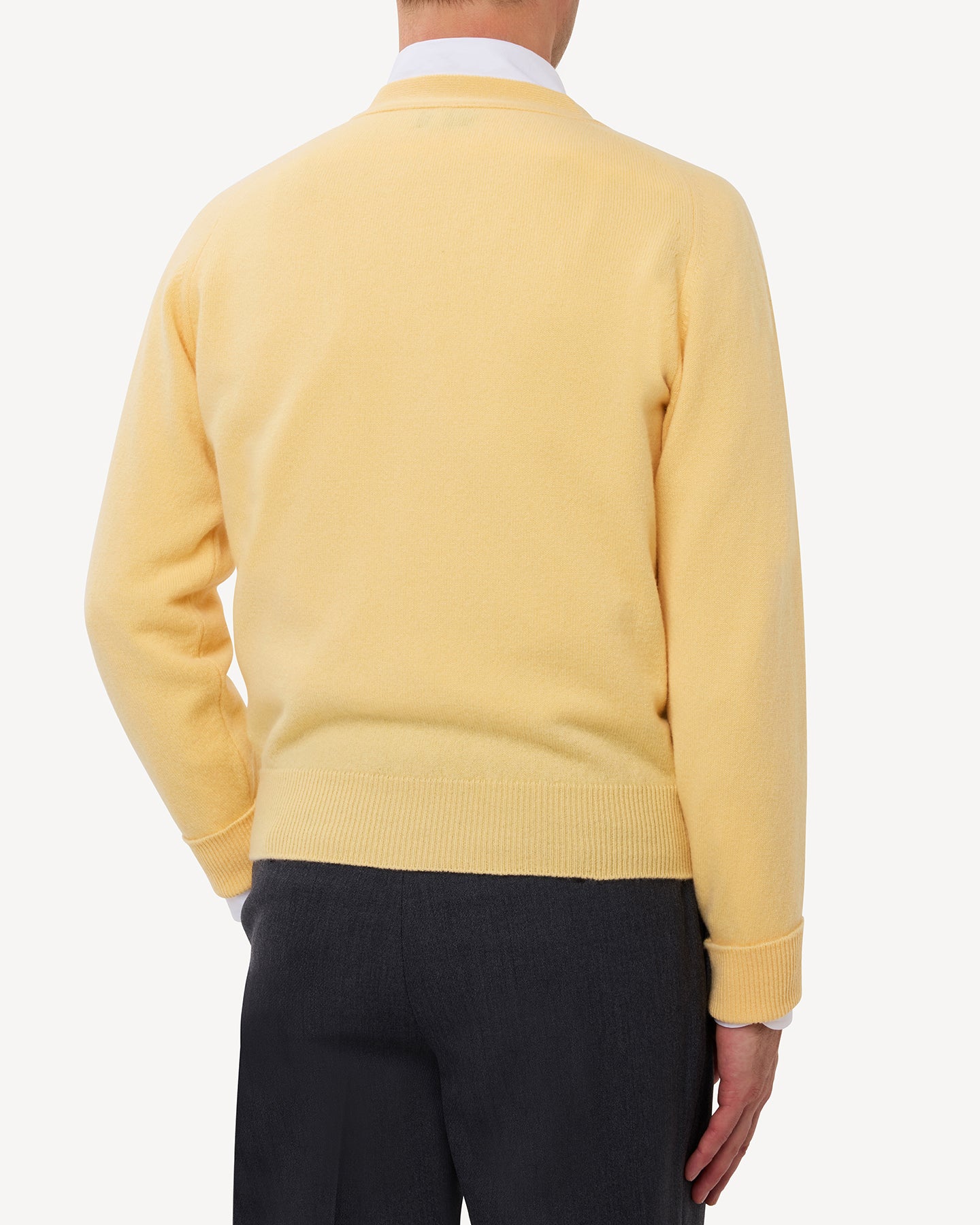 Man wearing a yellow lambswool cardigan