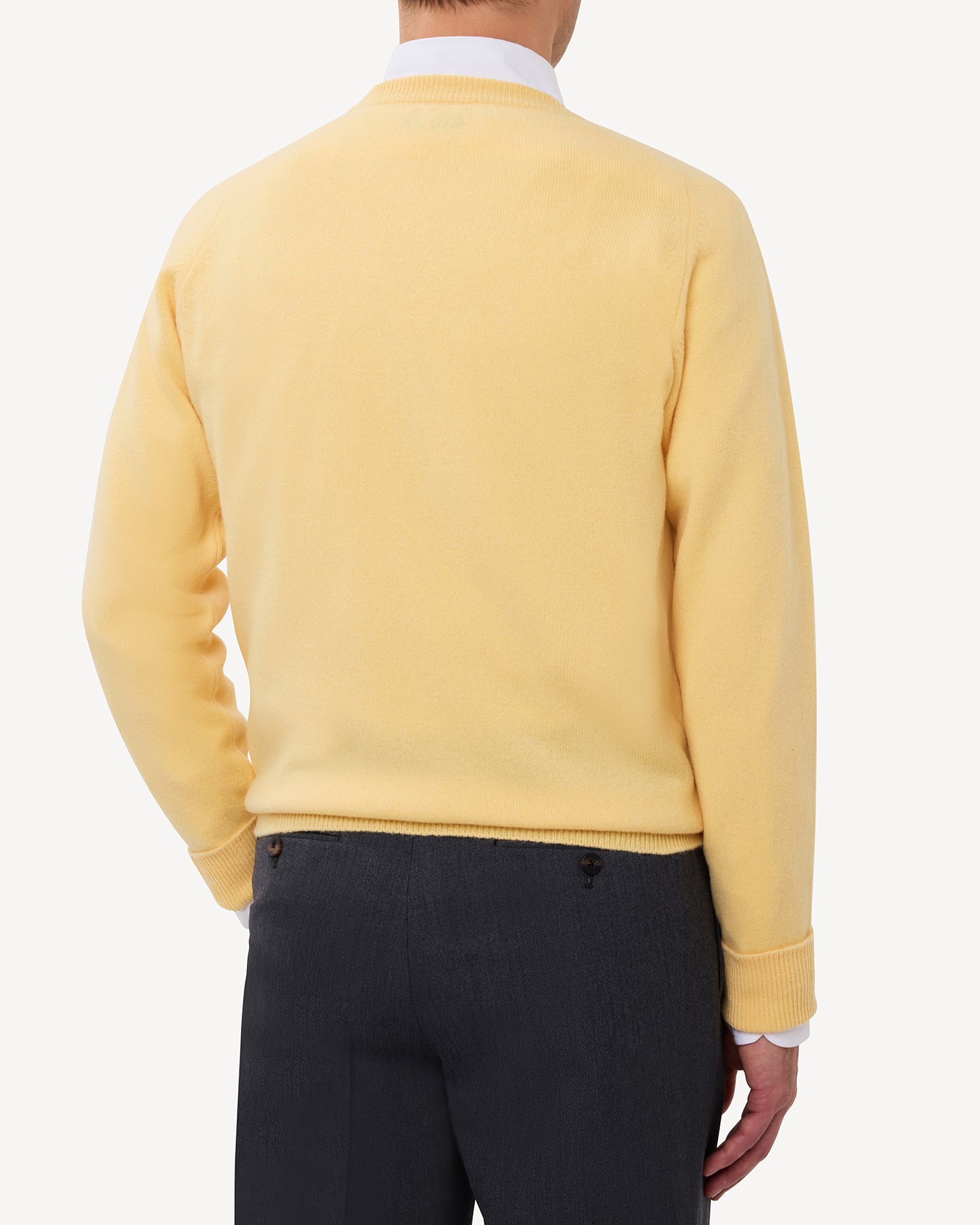 Man wearing a yellow lambswool crew neck sweater