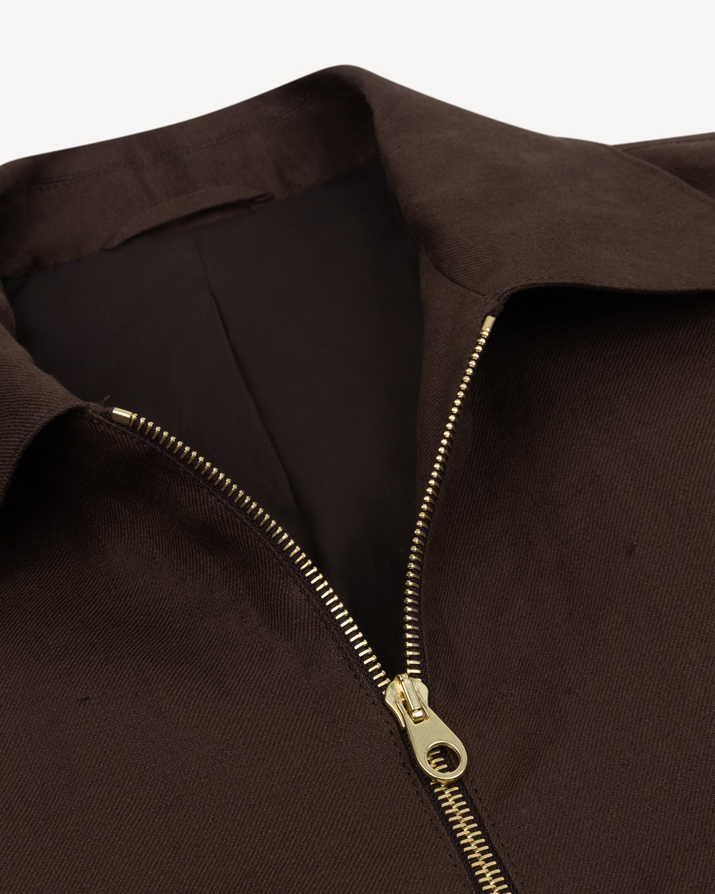 Brown bomber jacket with brass zipper