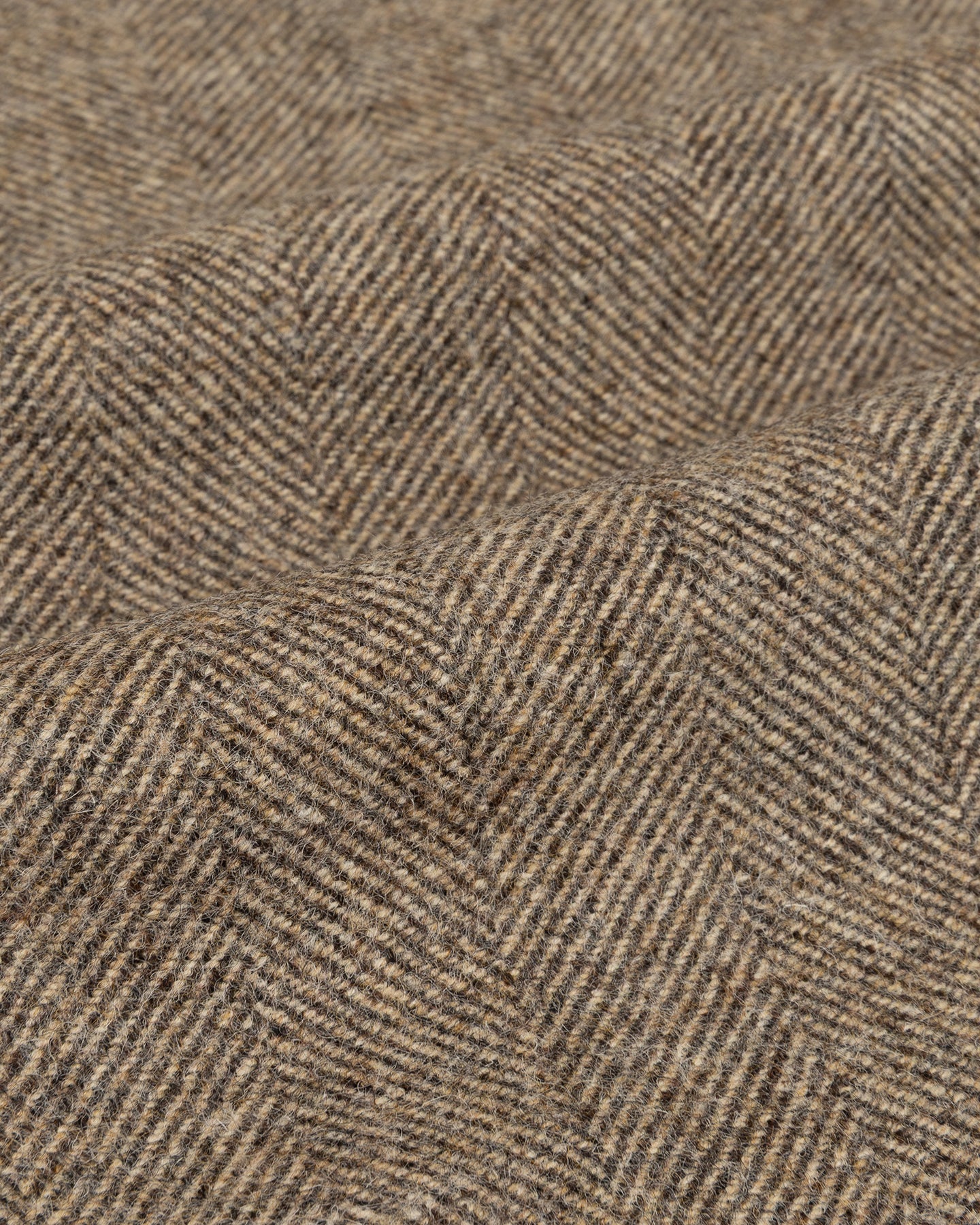 Light brown herringbone shetland tweed fabric