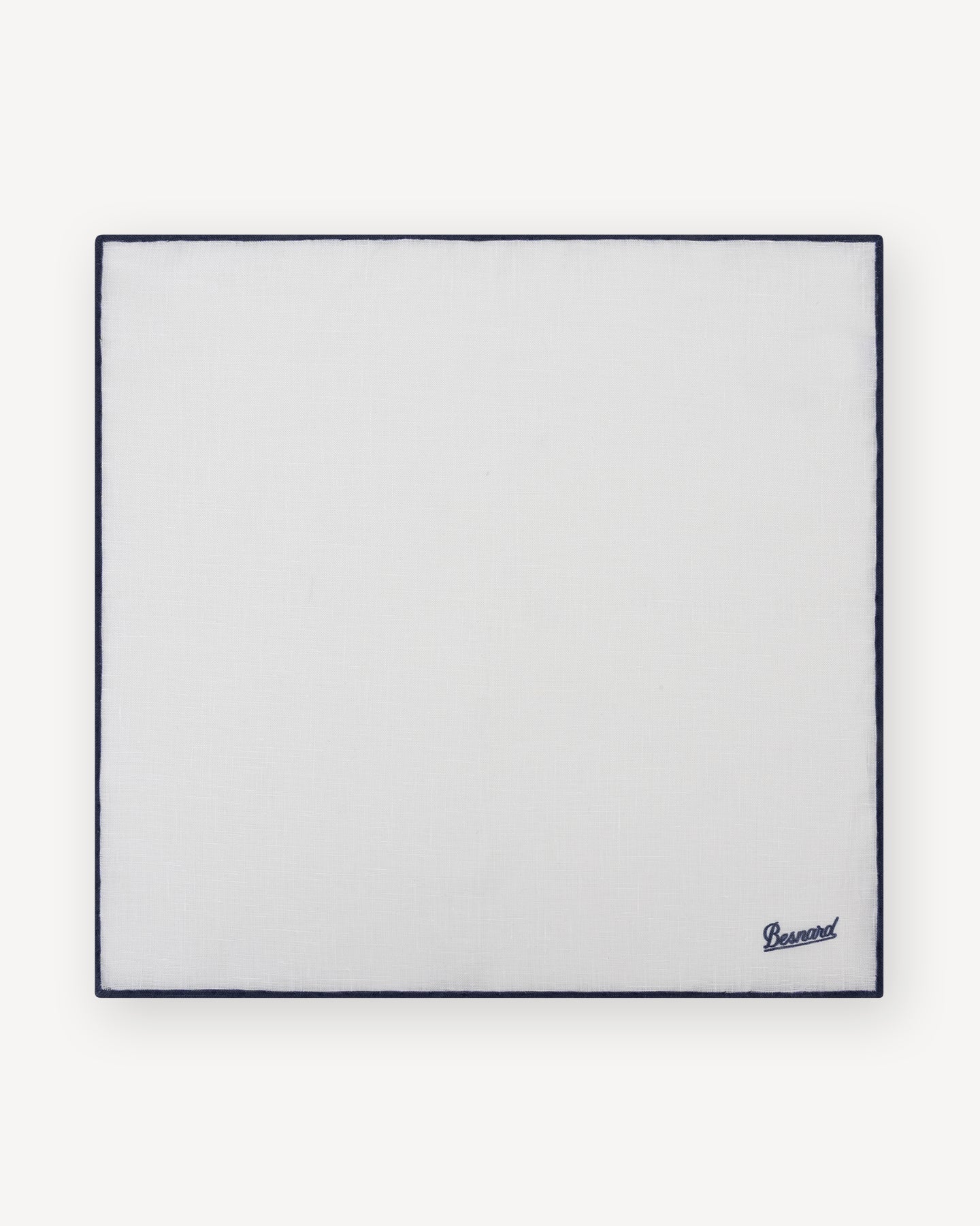 White linen pocket square with navy shoestring border