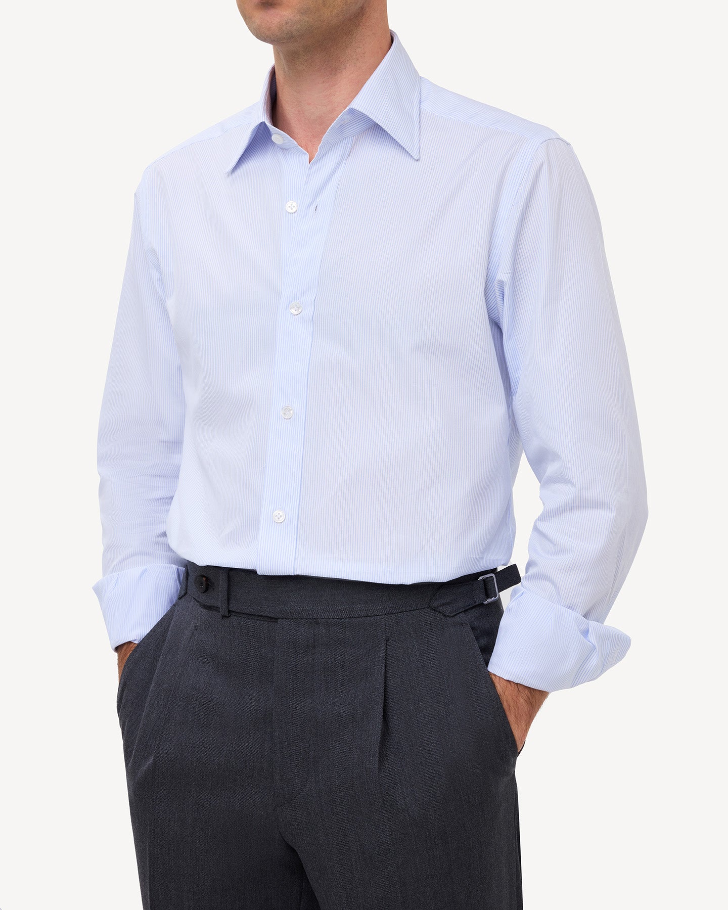 Man wearing a light blue hairline stripe poplin shirt with a point collar