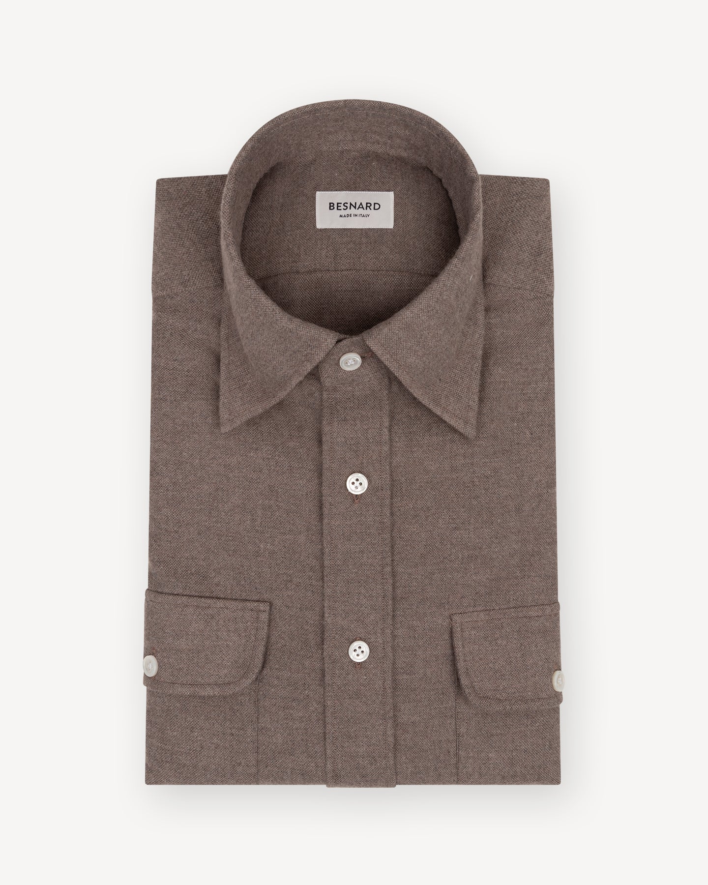 Taupe shirt with a point collar on a white background