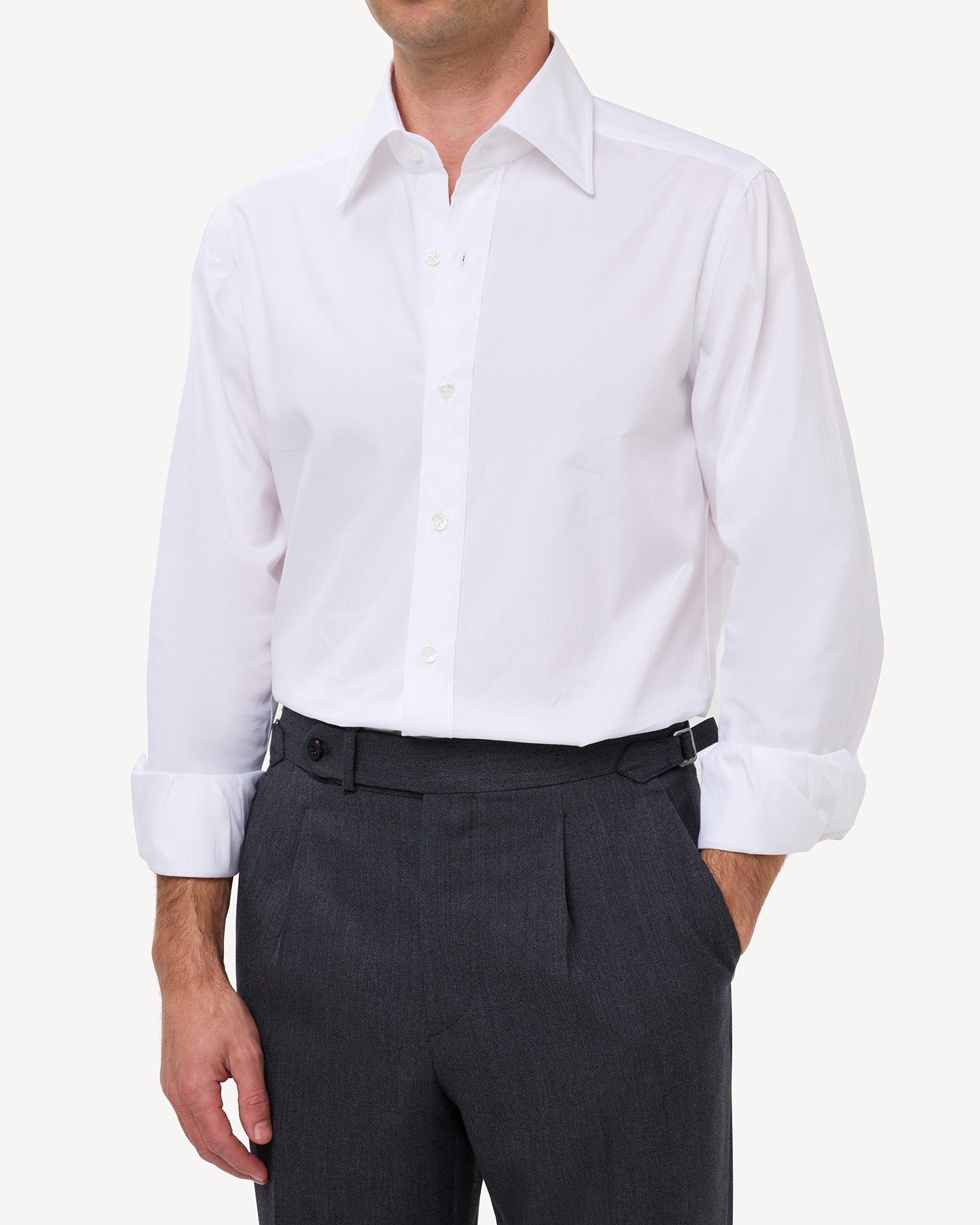 Man wearing a white pinpoint oxford shirt with a point collar