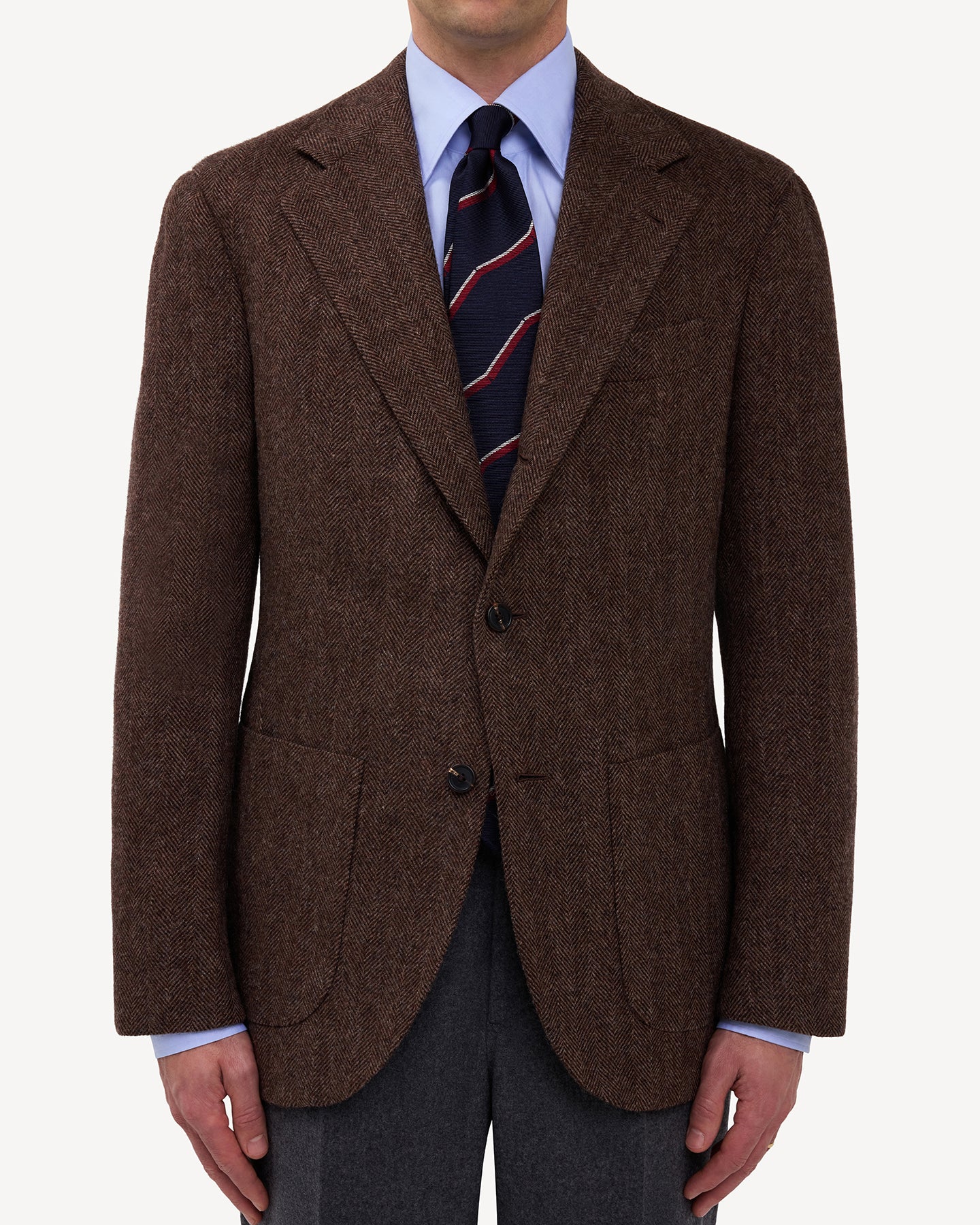 Man wearing a Brown Herringbone Tweed Sport Coat with a blue point collar shirt and repp tie