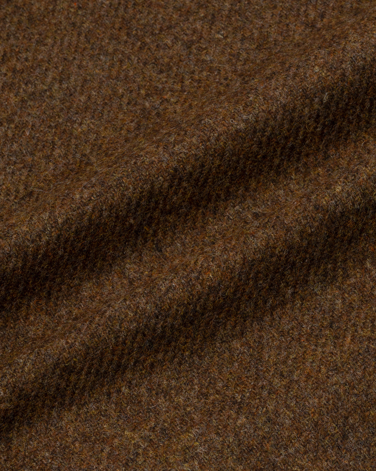 Detail van tobacco bruine merino twill met een geborsteld oppervlak