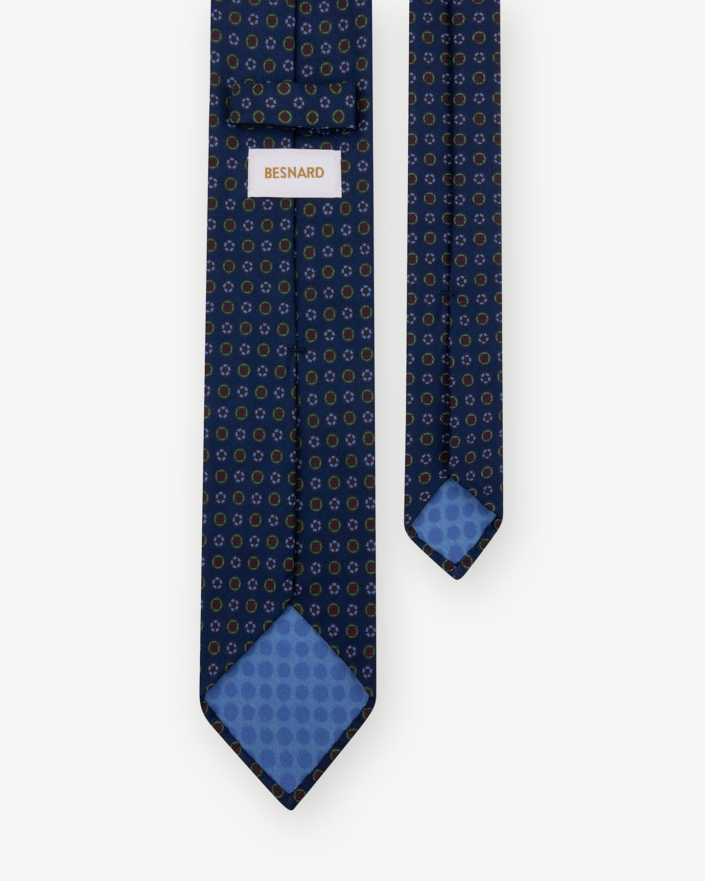 Dark blue Ancient Madder tie with small floral pattern and handrolled blades