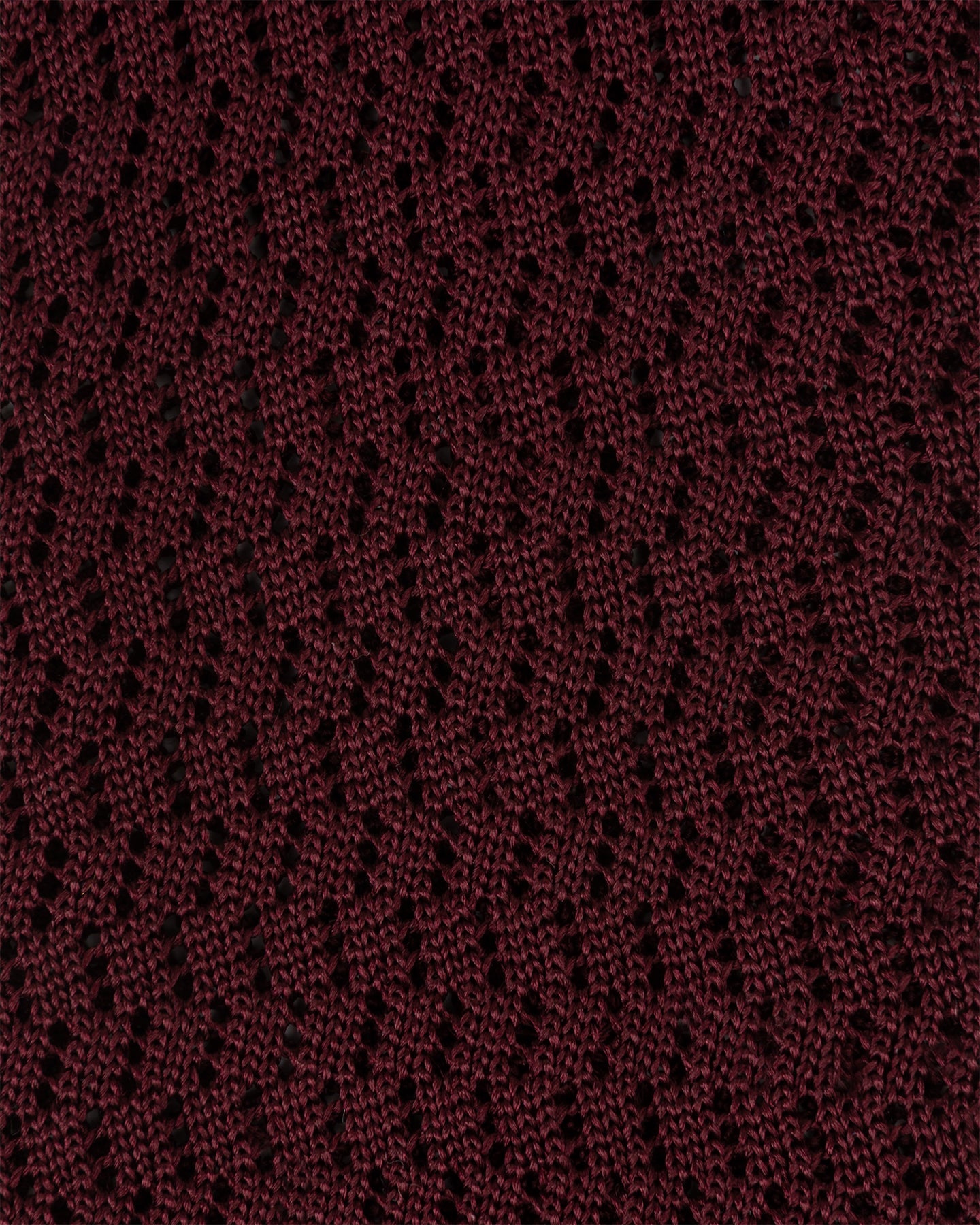 Close-up of burgundy zigzag knitted tie