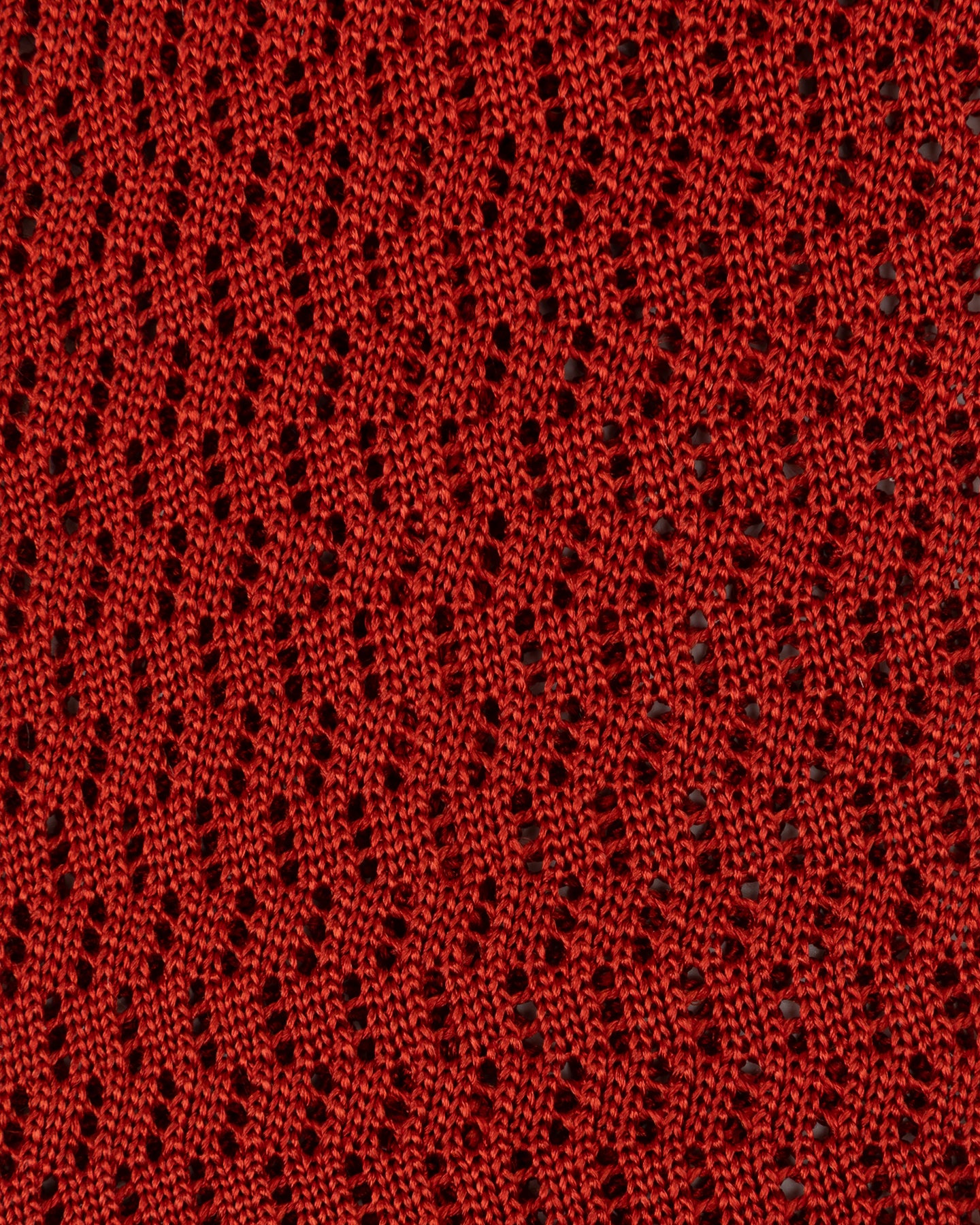 Close-up of rust zigzag knitted tie