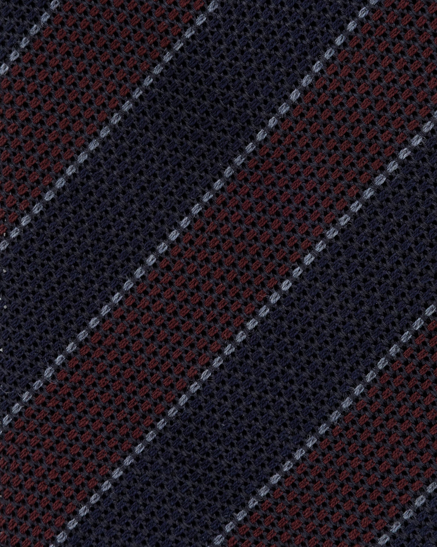 Close-up of navy and burgundy grenadine weave