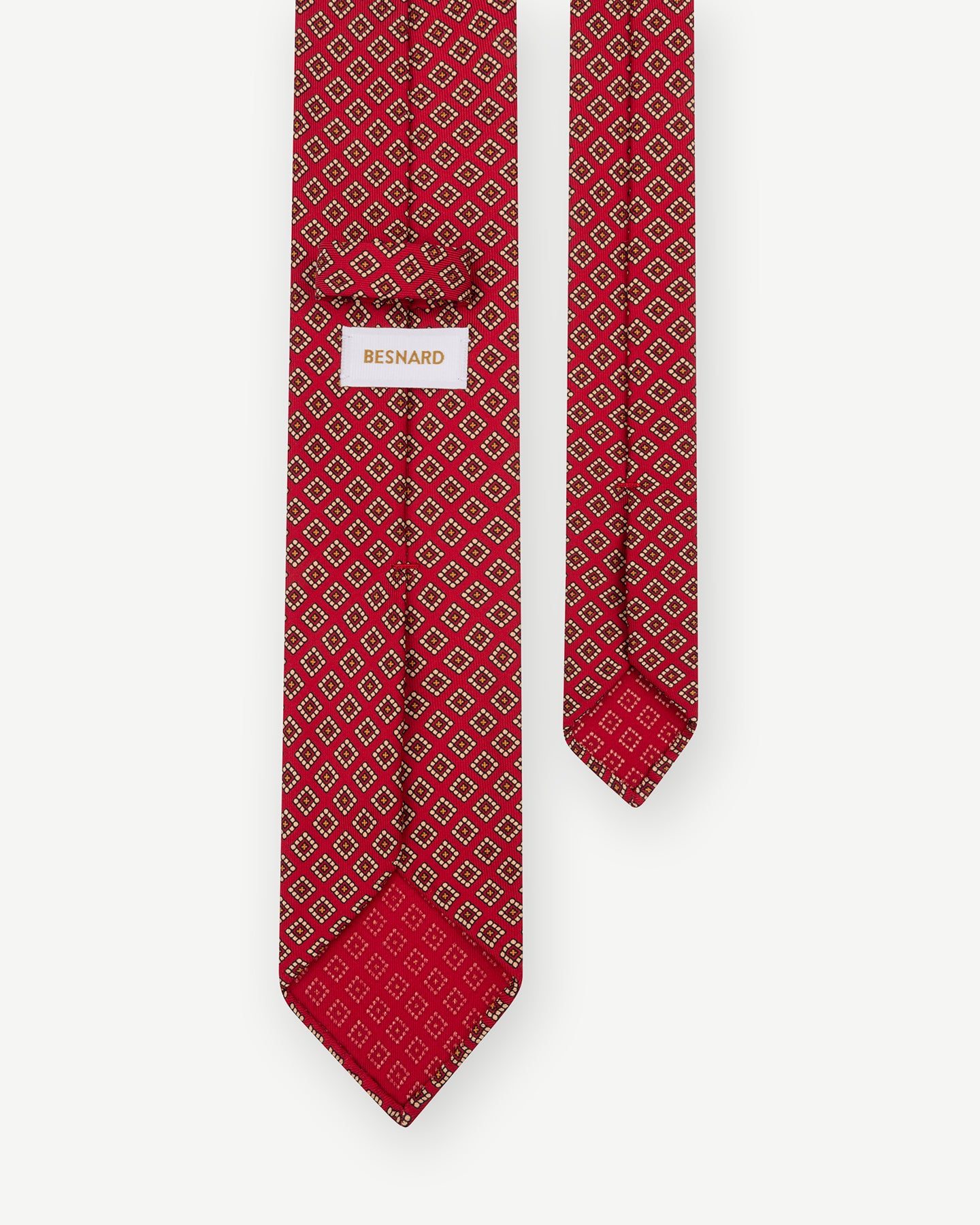 Red Ancient Madder tie with small medallion pattern with handrolled blades