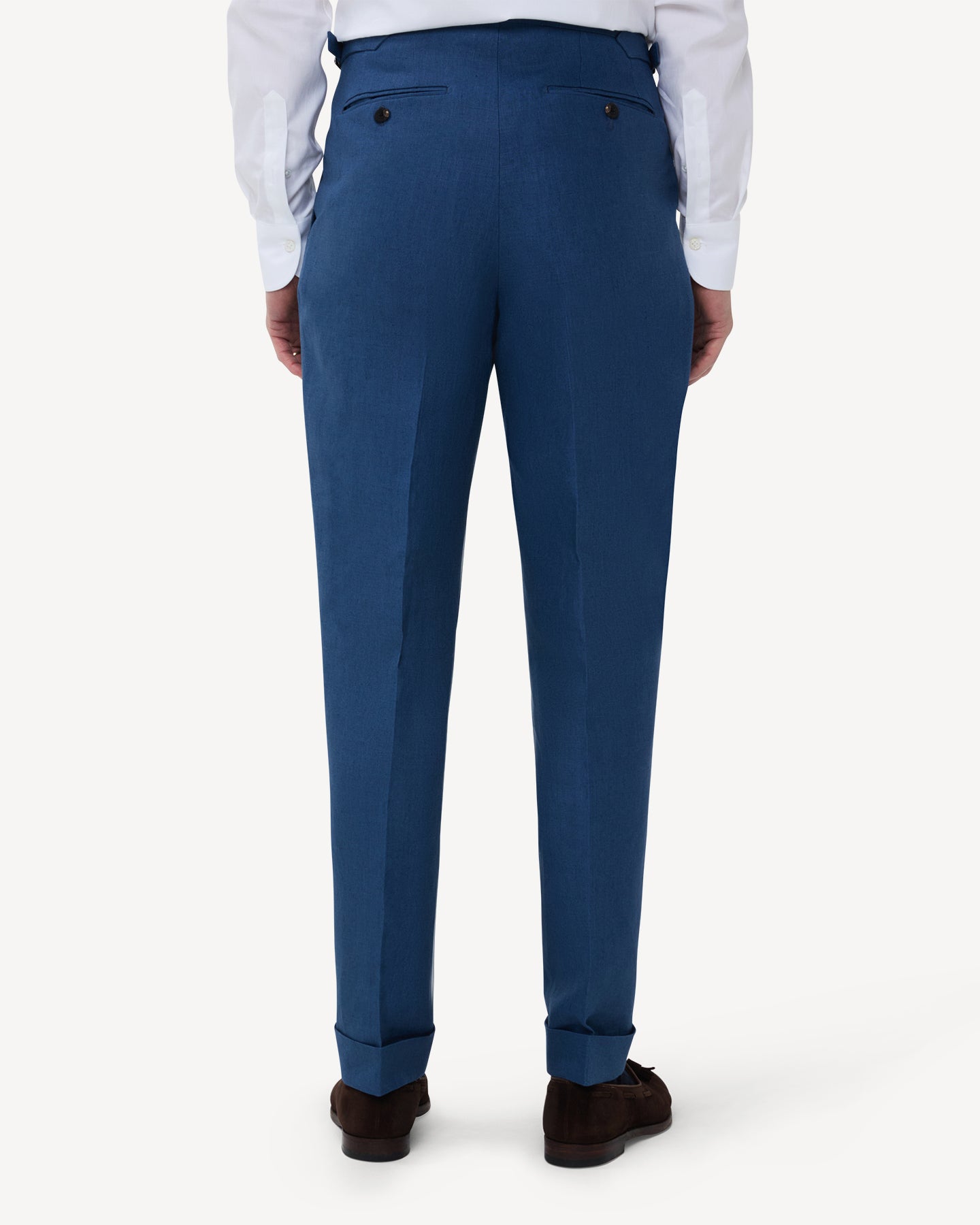 The back of blueberry linen trousers with single pleats and side adjusters