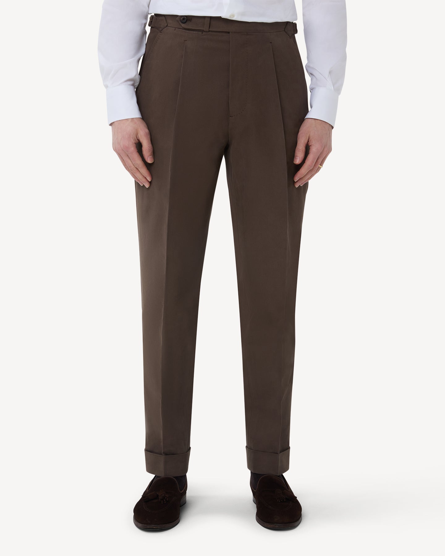 The front of tobacco cotton trousers with single pleats and side adjusters