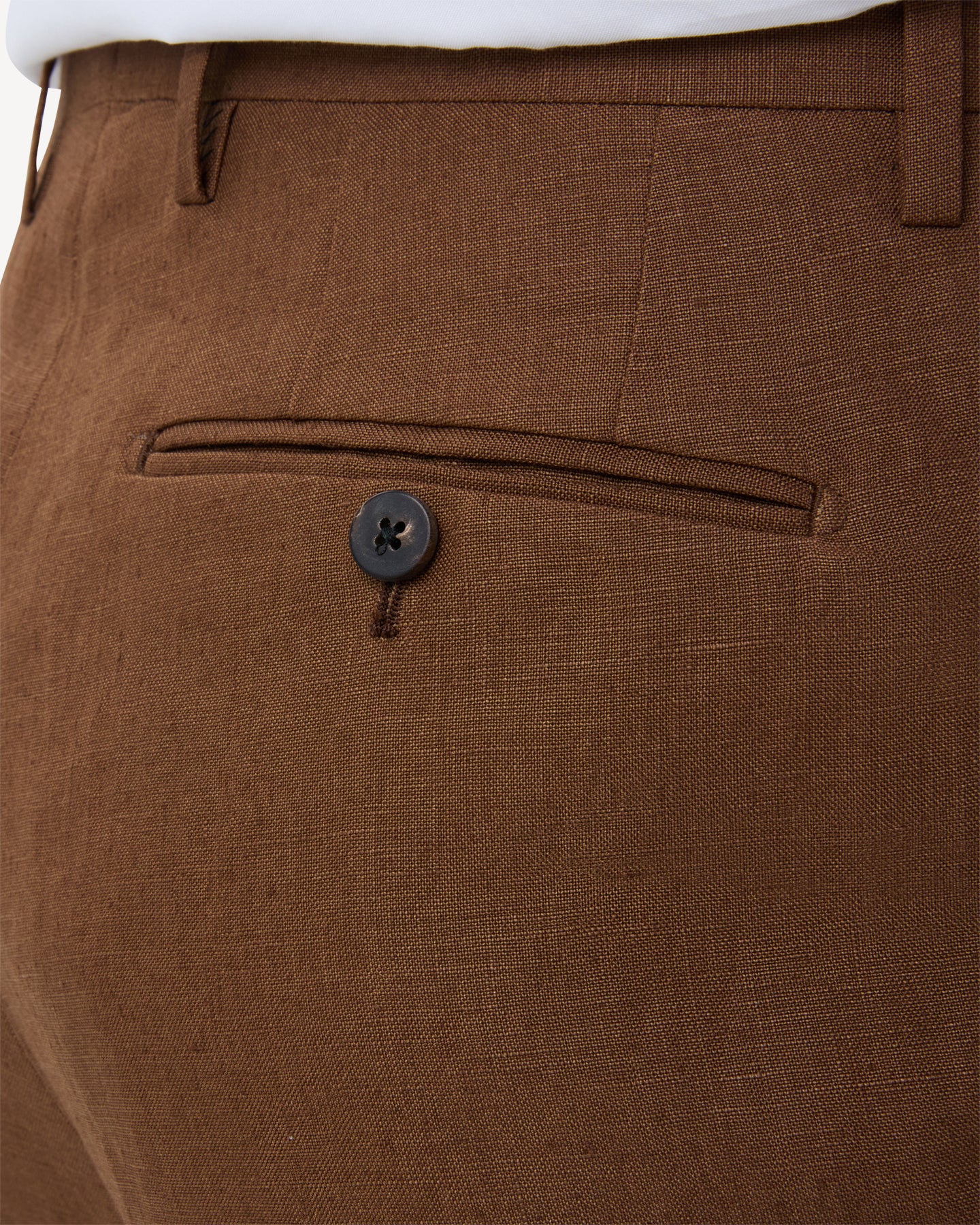 Dark tan linen trousers with horn buttons