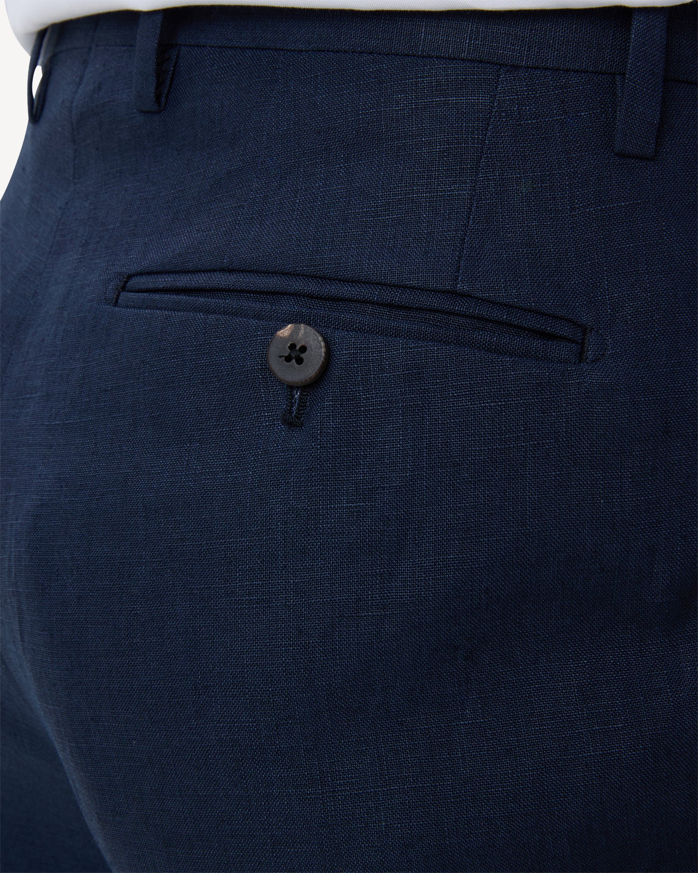 Navy linen trousers with horn buttons