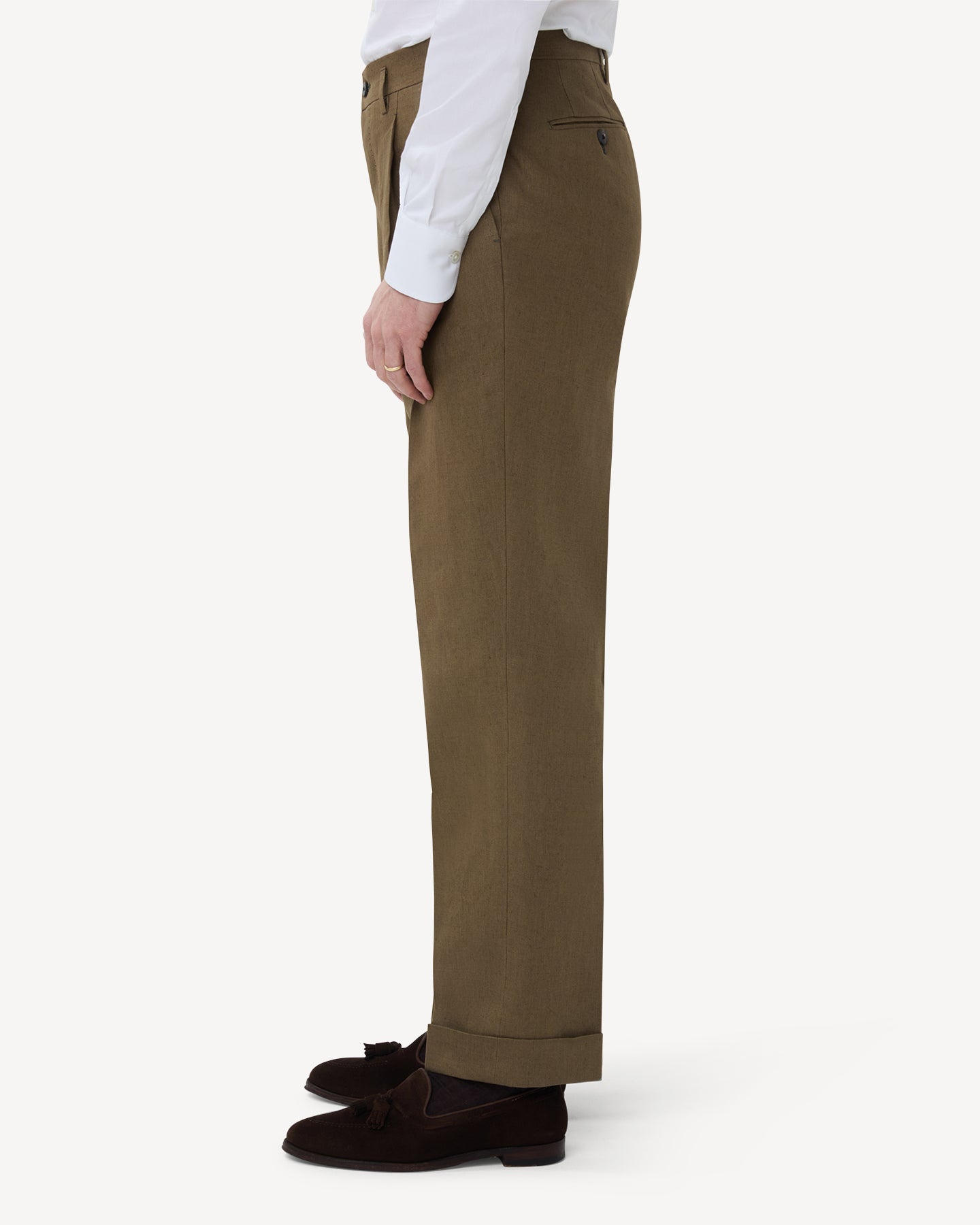 The side of olive brown linen trousers with double pleats and belt loops