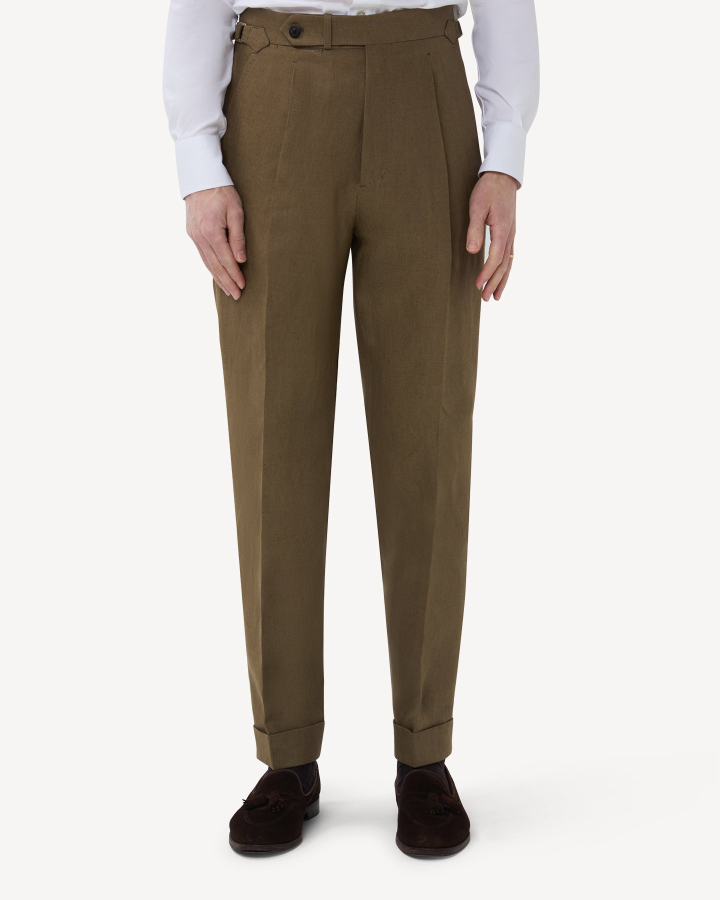 The front of olive brown linen trousers with single pleats and side adjusters