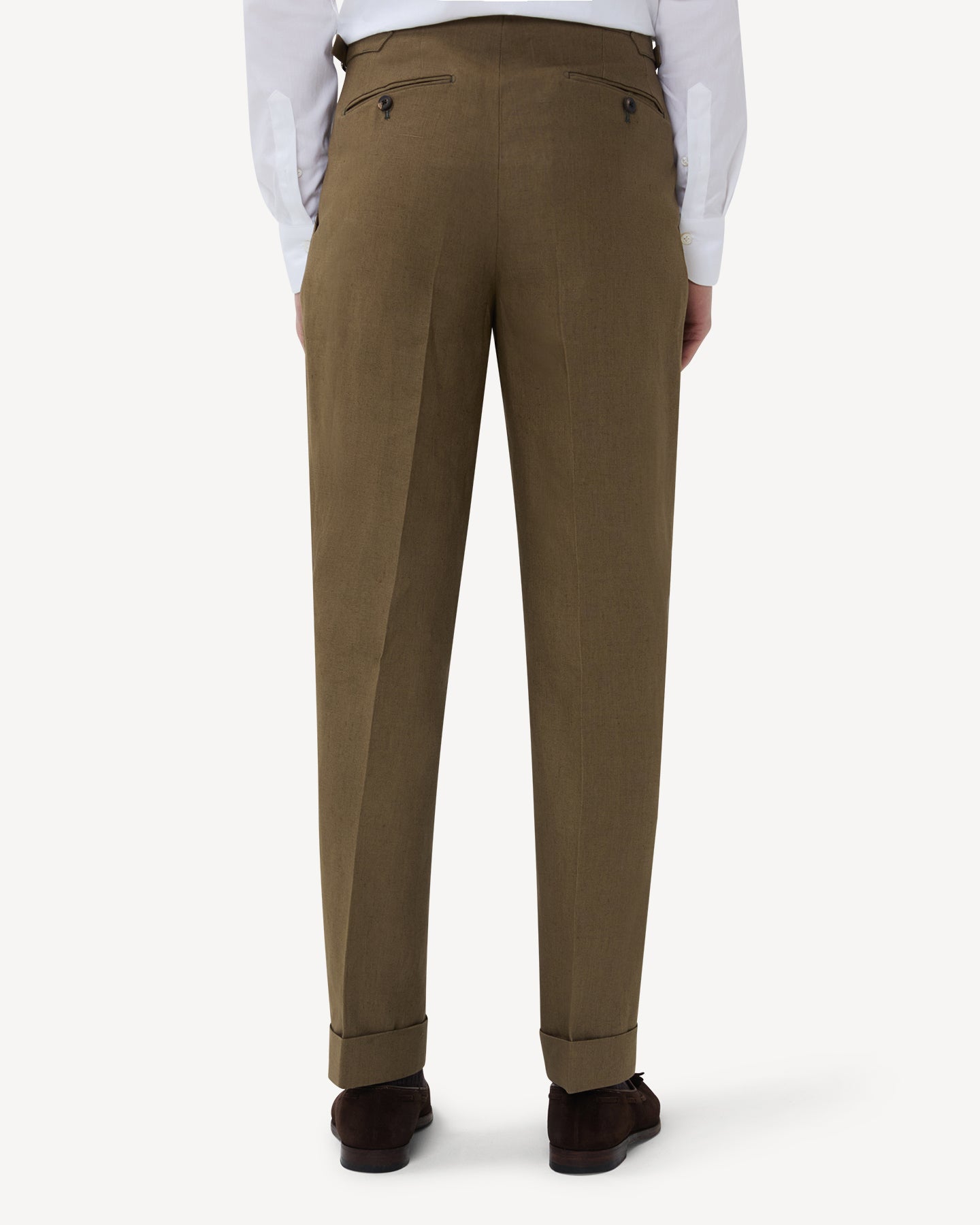 The back of olive brown linen trousers with single pleats and side adjusters