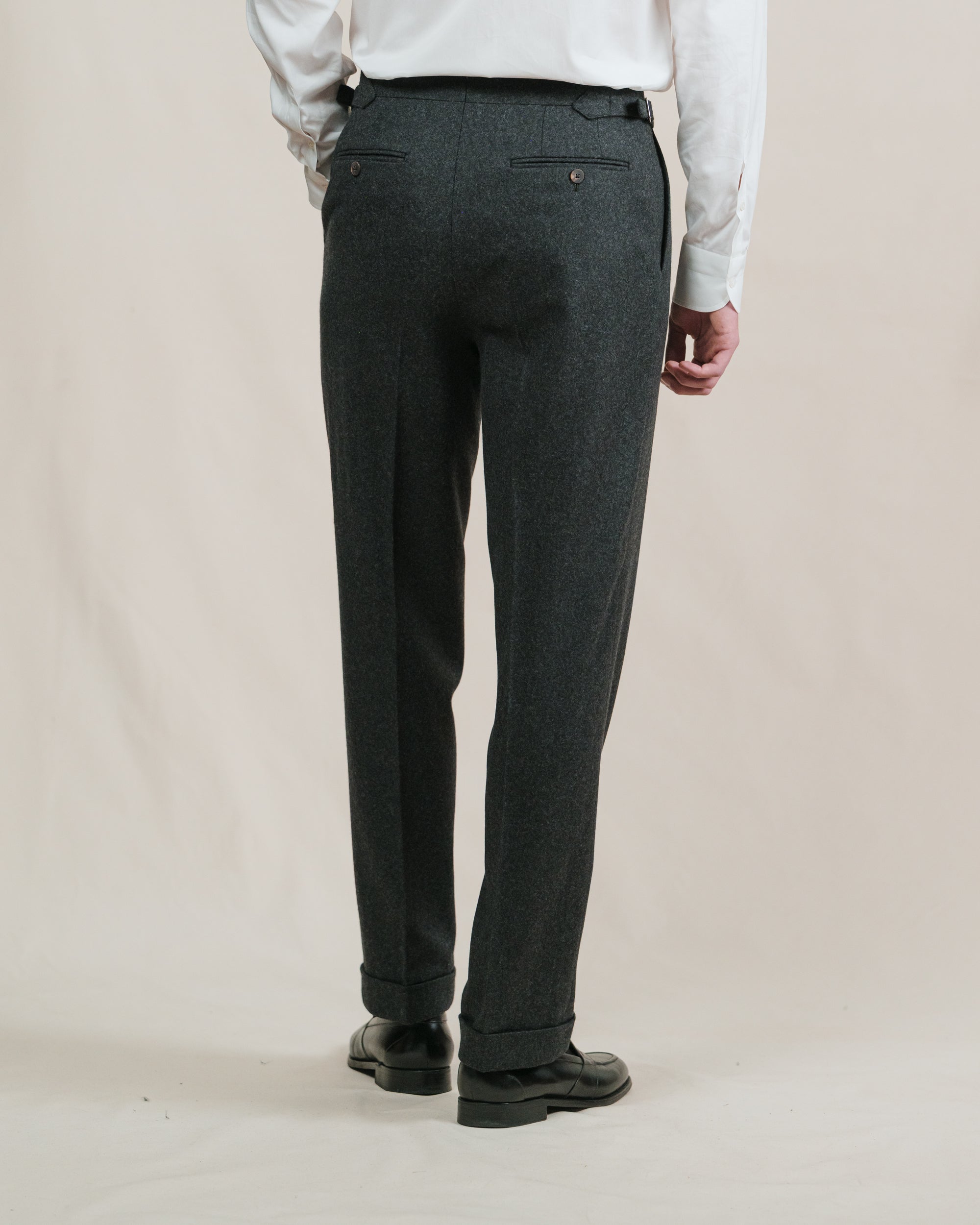 Man wearing a pair of charcoal flannel trousers